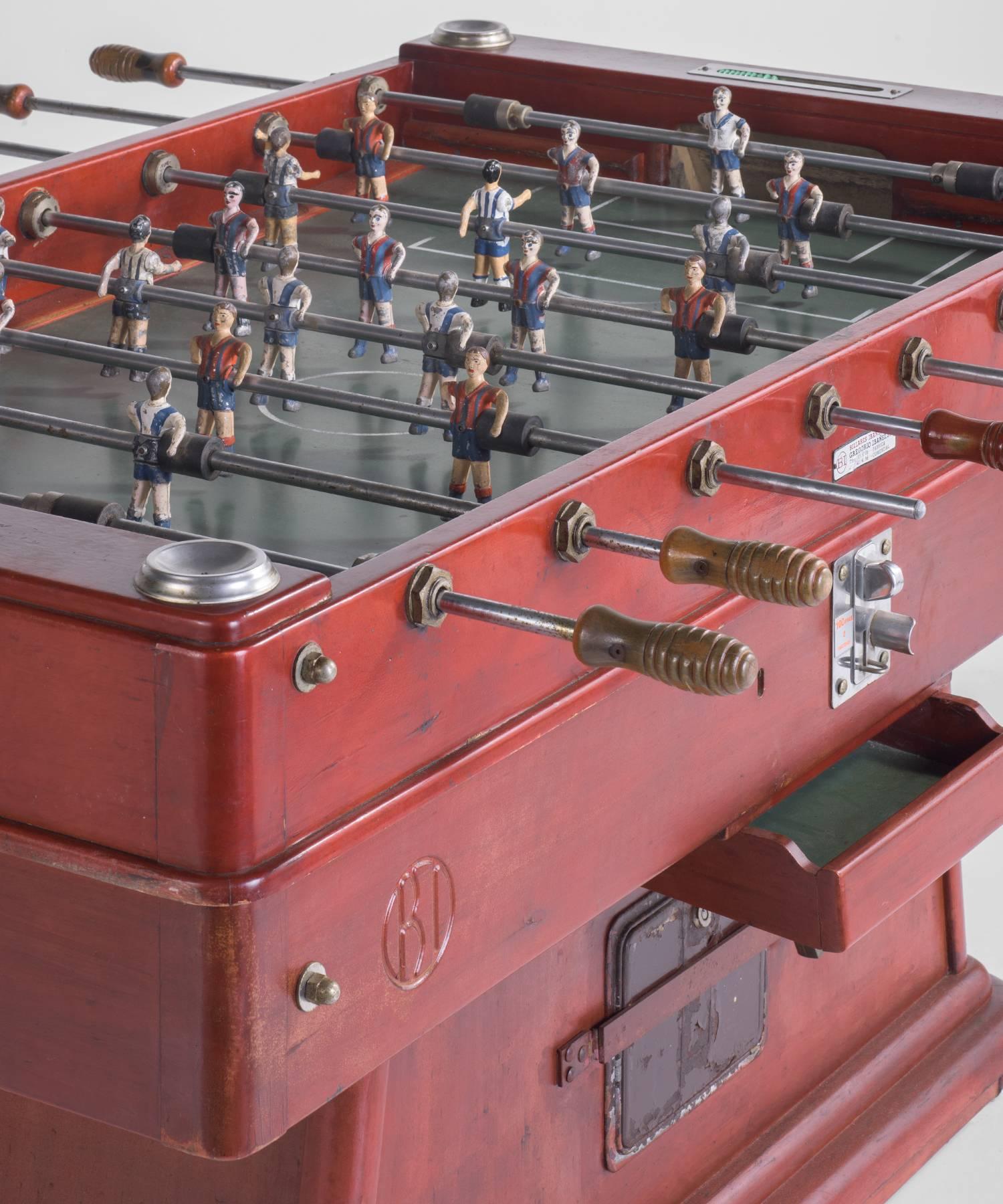 Spanish Foosball Table, circa 1960

Painted wood football game table with hand-painted metal players and original balls. Marked: Billares Ibañez, Gregorio Ibañez, S.A.

Measures: 65