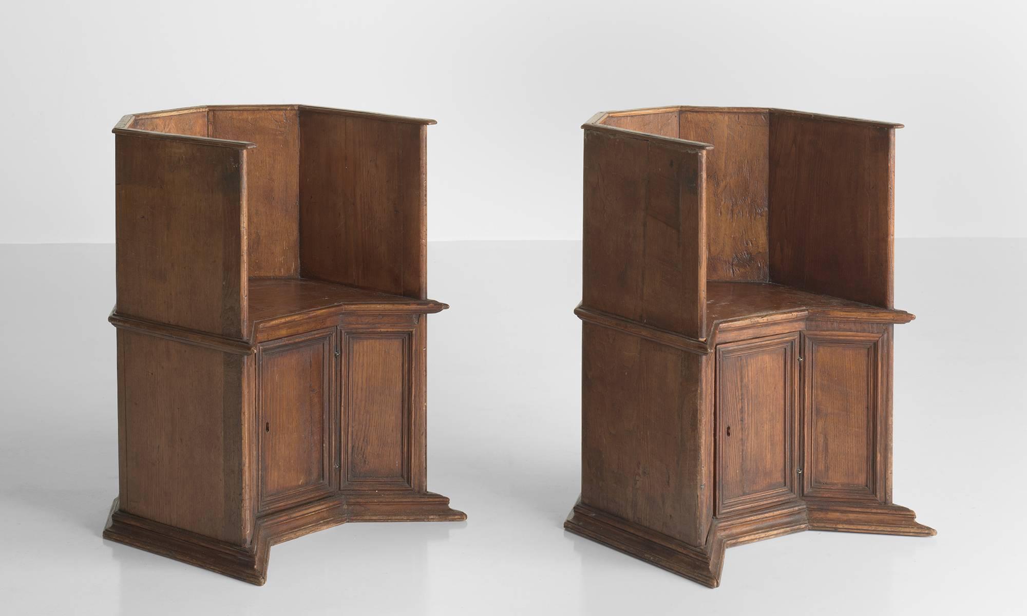 Pair of Gothic oak cathedral chairs, Italy, circa 1800.

Hand-crafted, beautiful forms with rich patina includes a door under the seat for storage.