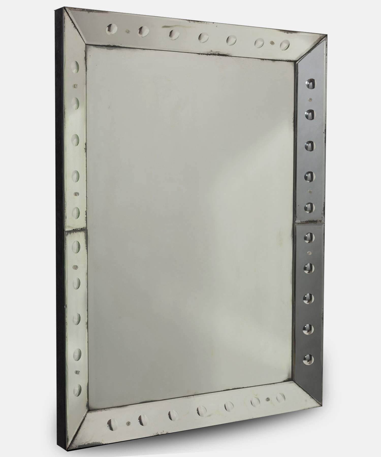 Unique Deco Mirror, England, circa 1950.

Original glass mirror with black velvet surround.

Measures: 39" L x 1.6" D x 59" H.