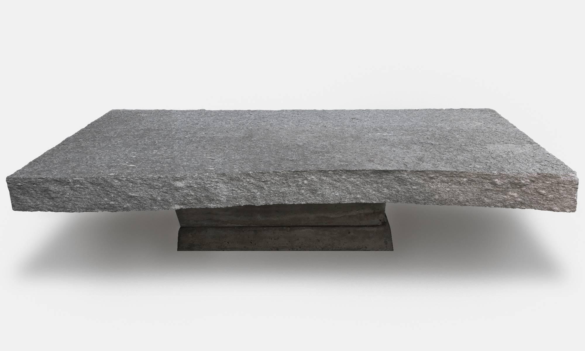 Primitive stone coffee table, Italy circa 1910

Thick stone slab on cast cement base.

Measures: 55