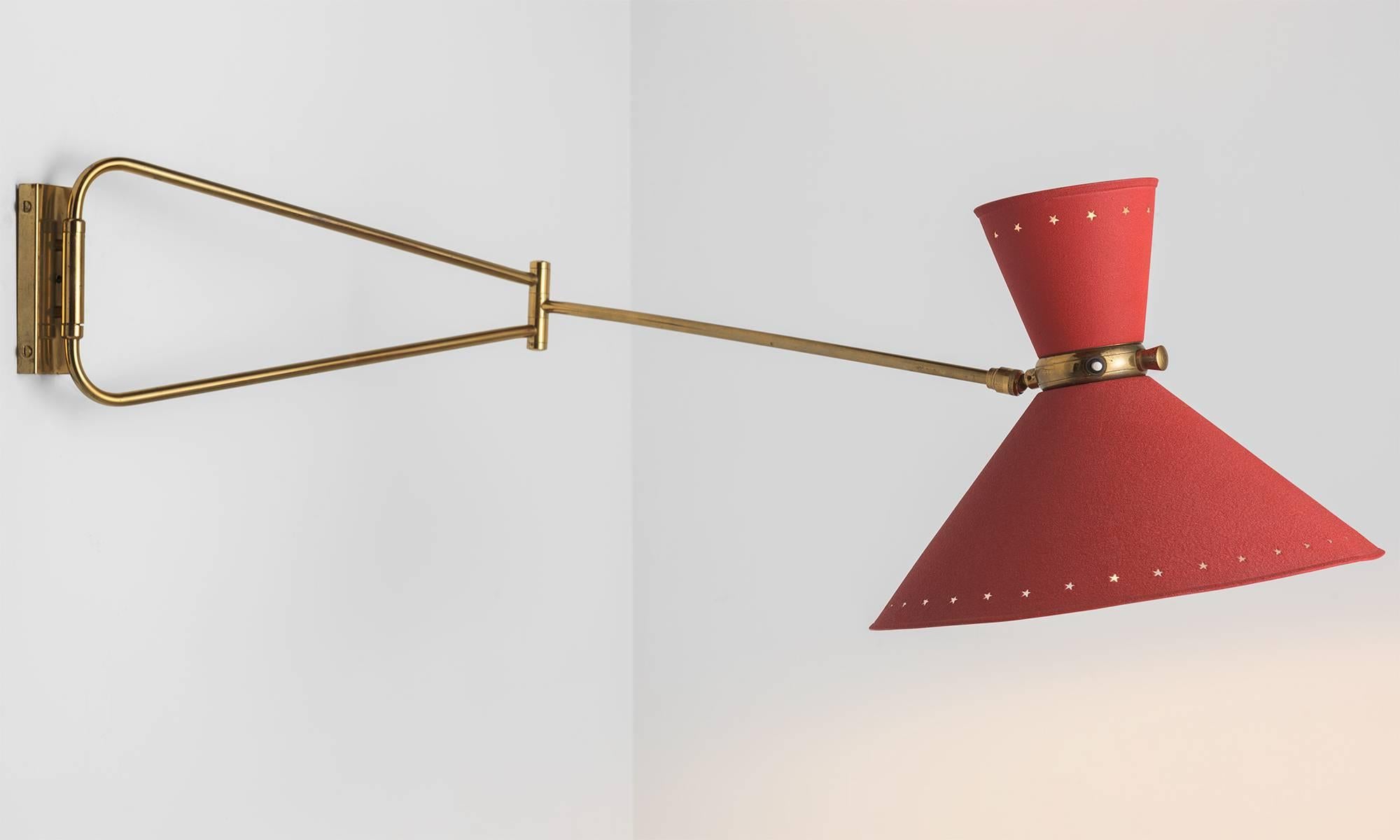 Red Swing Arm Wall Sconce by Rene Mathieu, circa 1950

Double cone shade in matte red with star perforations and polished brass hardware with three points of adjustment. Designed by Rene Mathieu for Lunel France.