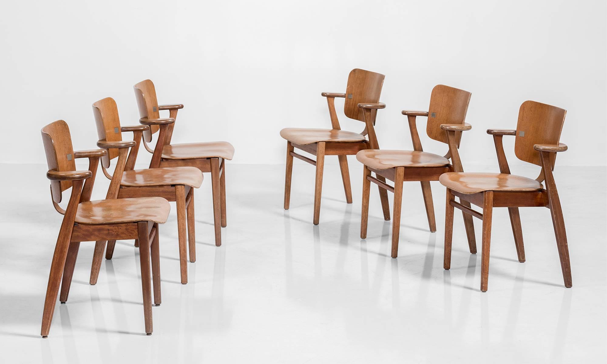 Wooden stacking chairs designed by Ilmari Tapiovaara, produced in 1953 by Keravan Puuteollisuus of Finland for U.S. distribution by Knoll.

Finland, circa 1953.