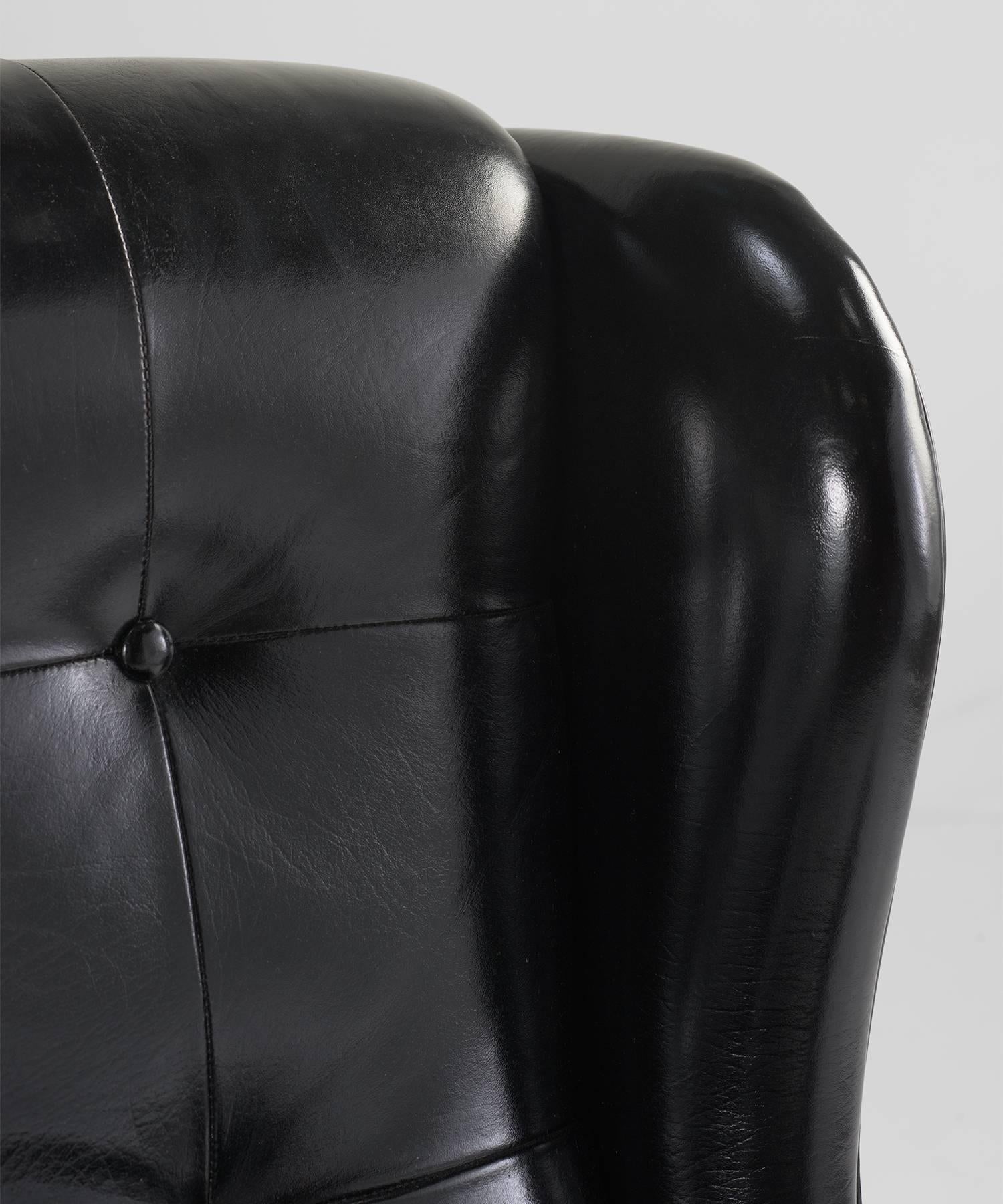 Mid-20th Century Black Leather Wing Armchairs, Sweden, circa 1950