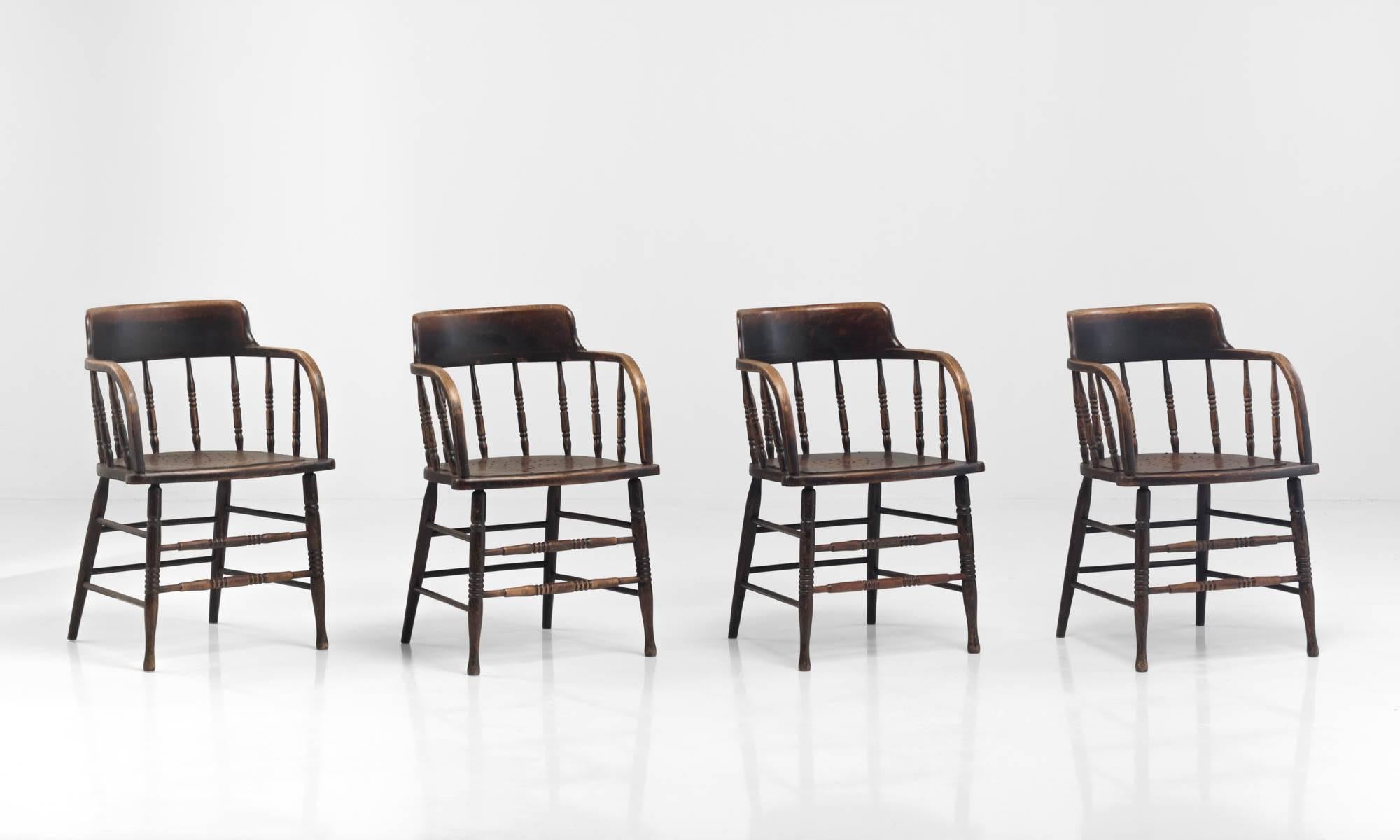Four Taylor and Hobson wooden armchairs.

Handsome armchairs with turned legs and supports. Marked Taylor and Hobson Limited: Huddersfield.

Made in England, circa 1900.