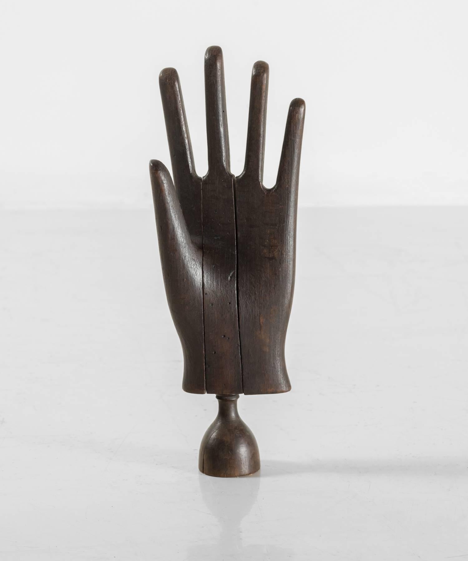 Wooden glove stretcher, circa 1890.

Haberdashery form, crafted to display and stretch leather gloves.