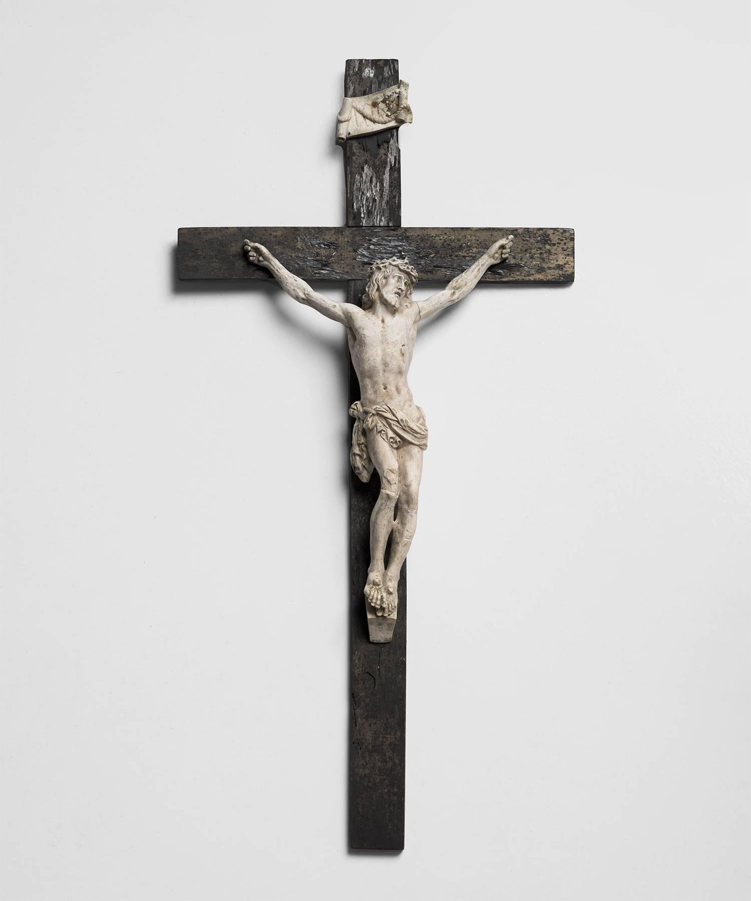 Cast plaster Christ mounted to distressed wood.