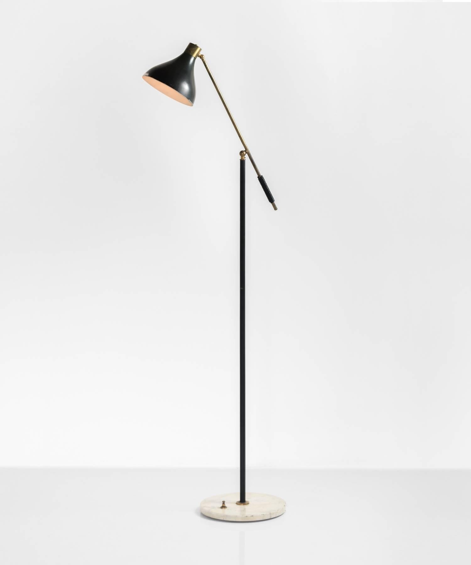 Black metal floor lamp with brass hardware on marble base.

Designed by Stilux in Italy, circa 1960.