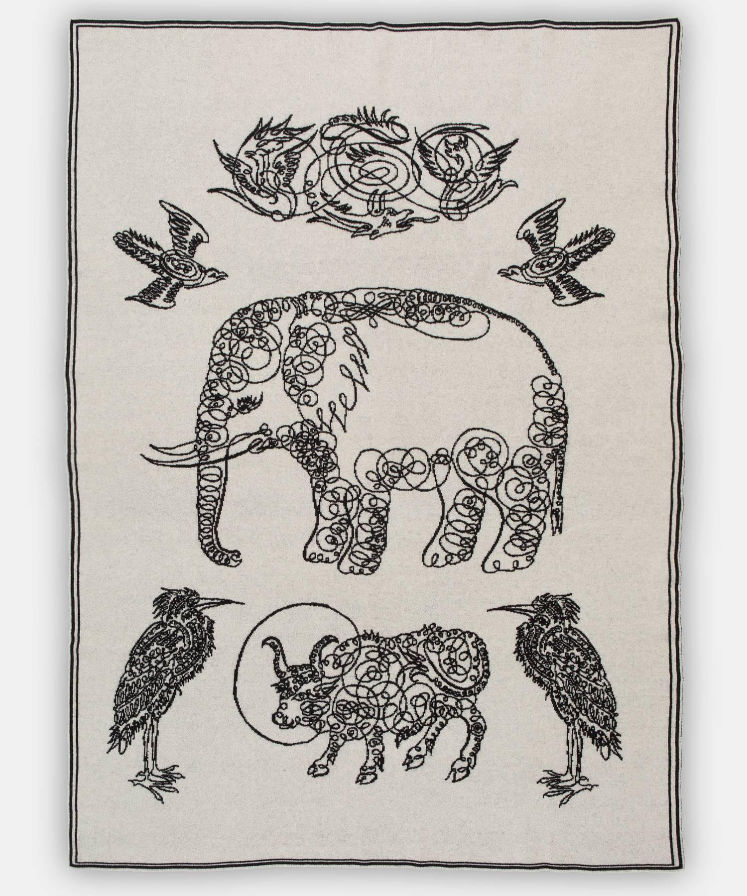 Elephant and friends blanket by Saved, New York.

Inspired by folkloric calligraphy drawing. Woven directly into the rich jacquard knit, these warm friends represent animals revered throughout the ages. Available in King and Queen sizes, please