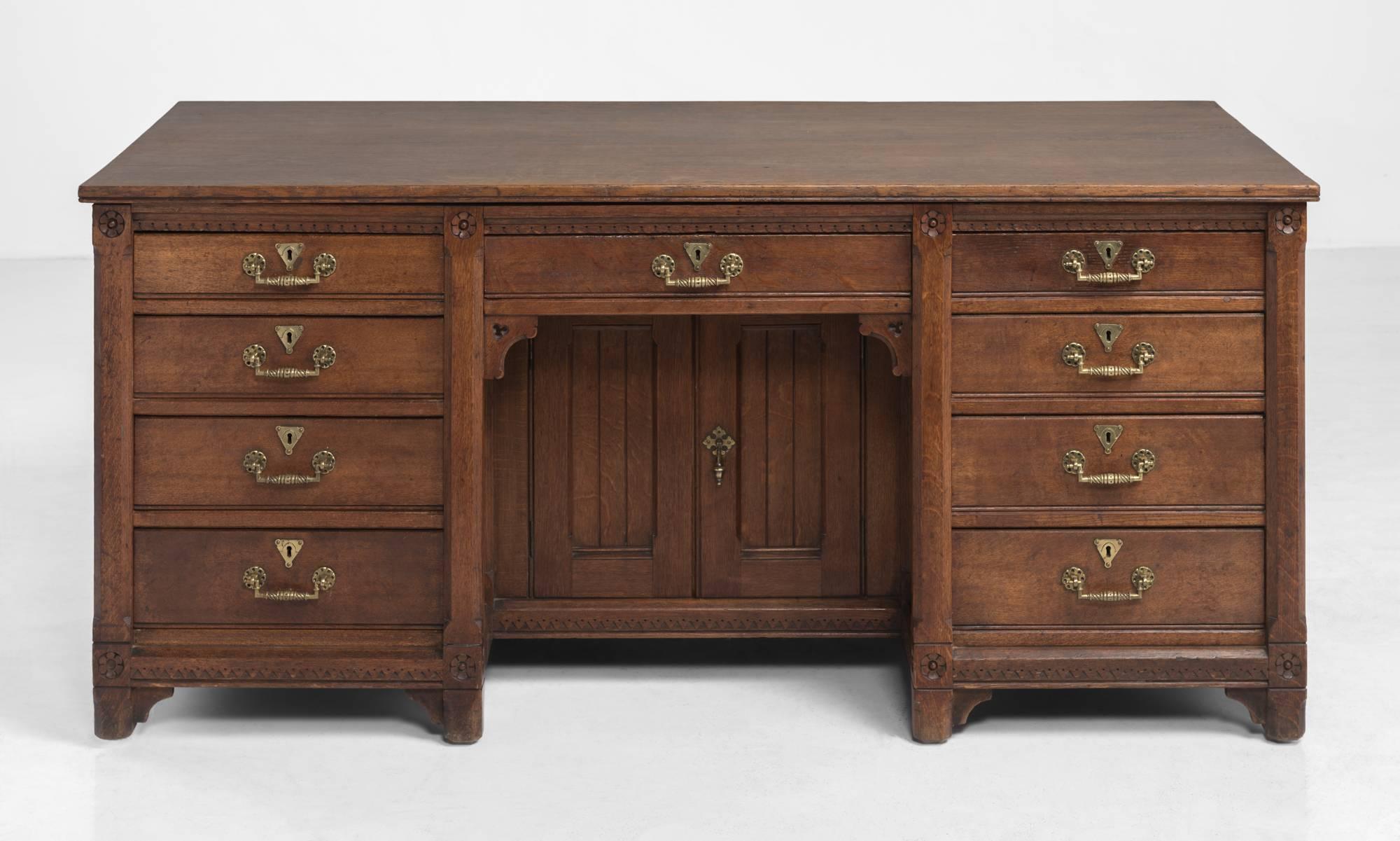 Handsome Oak Writing Desk, circa 1870

Sturdy construction with brass hardware and ornate detailing throughout. Made by Holland & Sons, London.