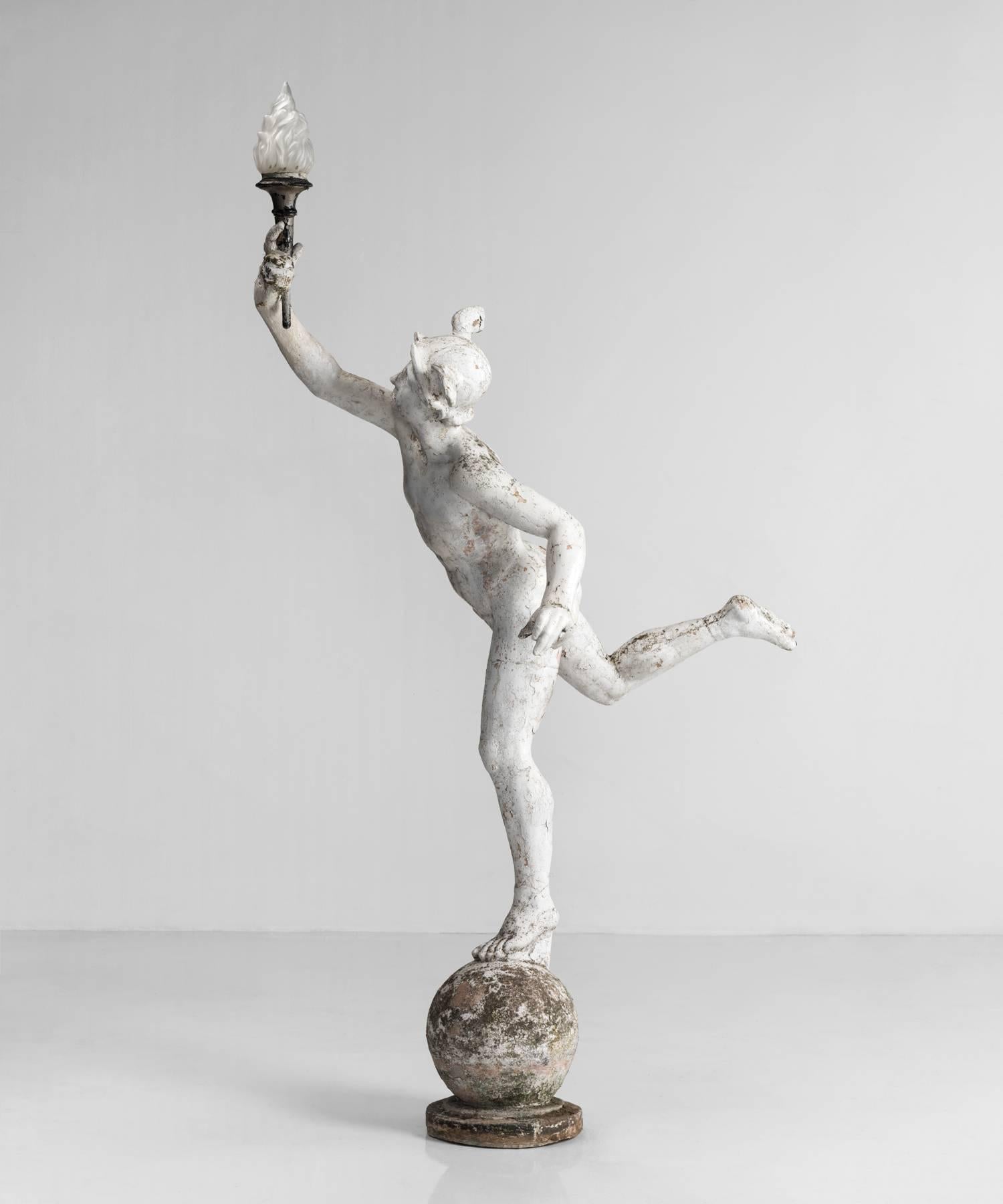 Plaster statue of Hermes made in France, circa 1950.

Life-size plaster statue of Hermes with amazing patina holding a decorative glass torch.
 