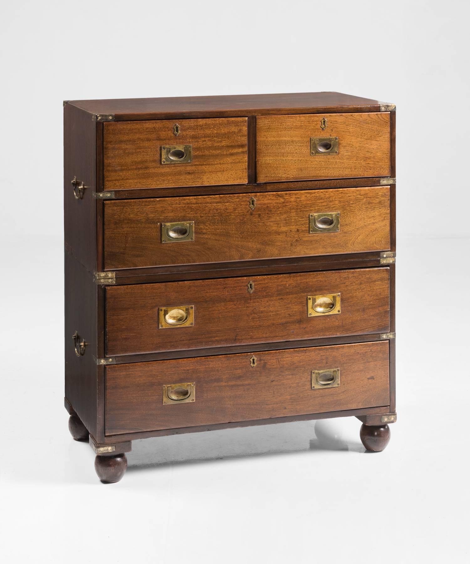 Campaign Chest of Drawers, England, circa 1930

Polished mahogany with brass hardware, on bun feet.