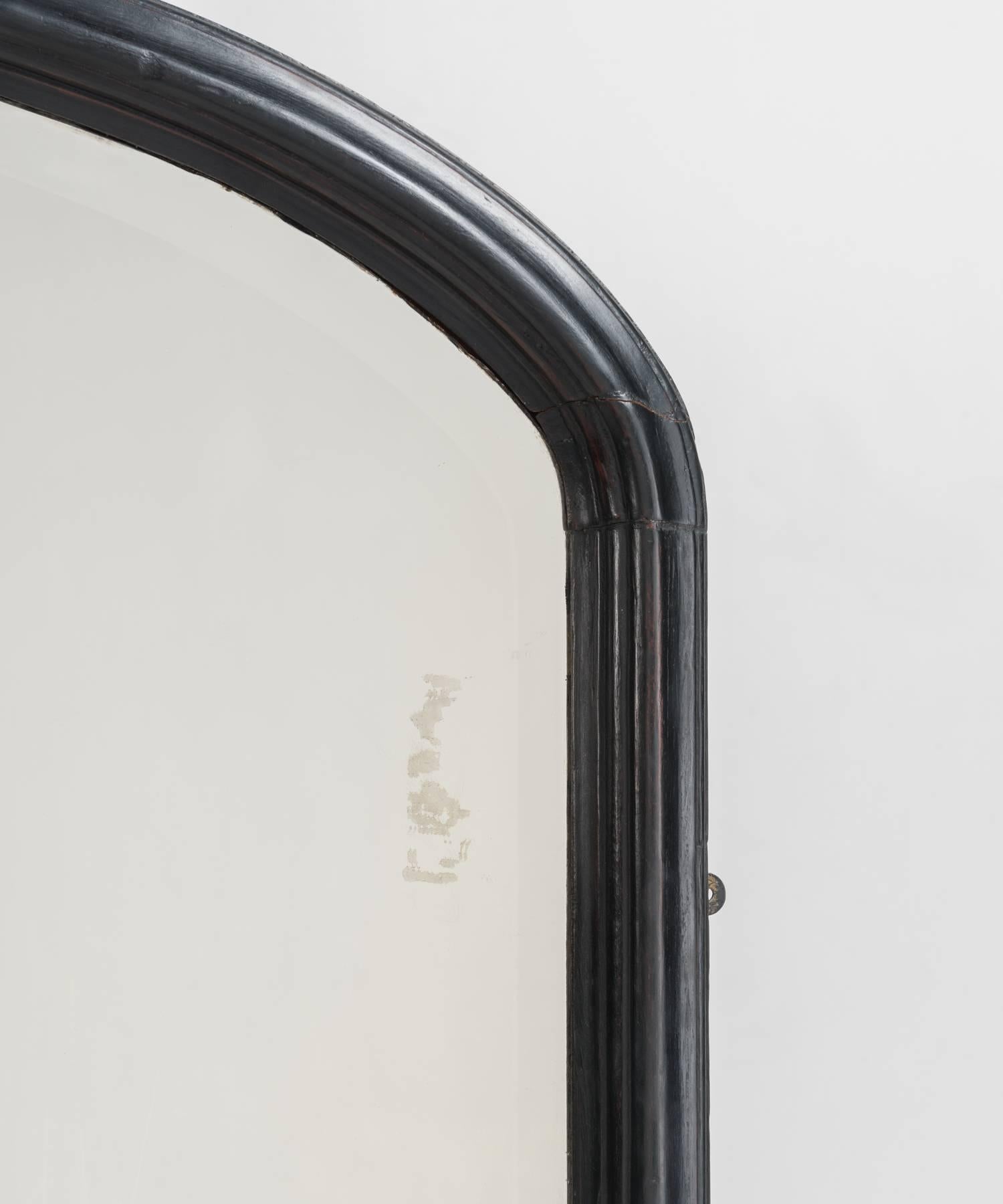 Arch top ebonised mirror, made in England, circa 1900.

Beautifully finished frame, with original plate glass mirror.