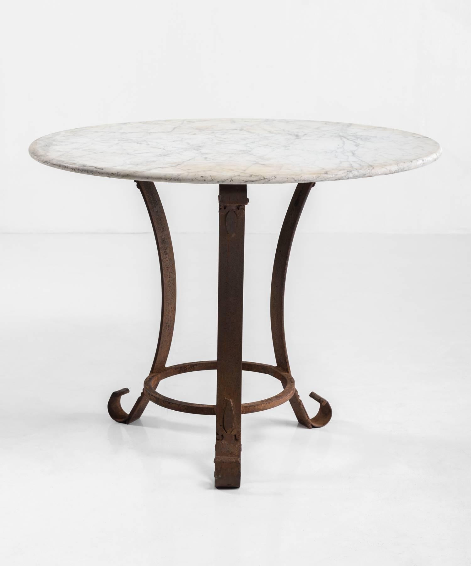 Iron and Marble Centre Table, circa 1890

Circular Carrara marble top on patinated iron base.