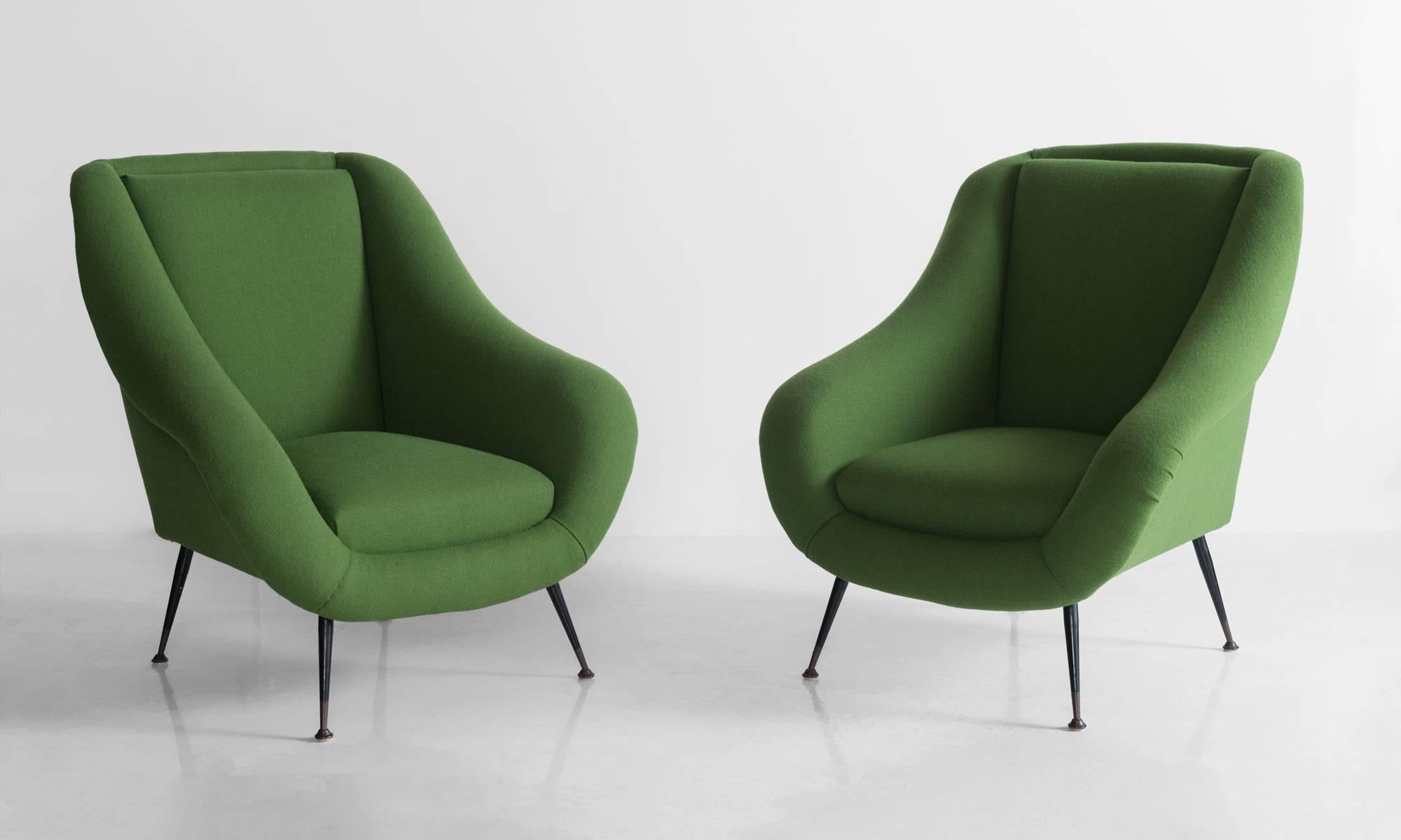 Handsome armchairs, newly reupholstered in green wool by Kvadrat.