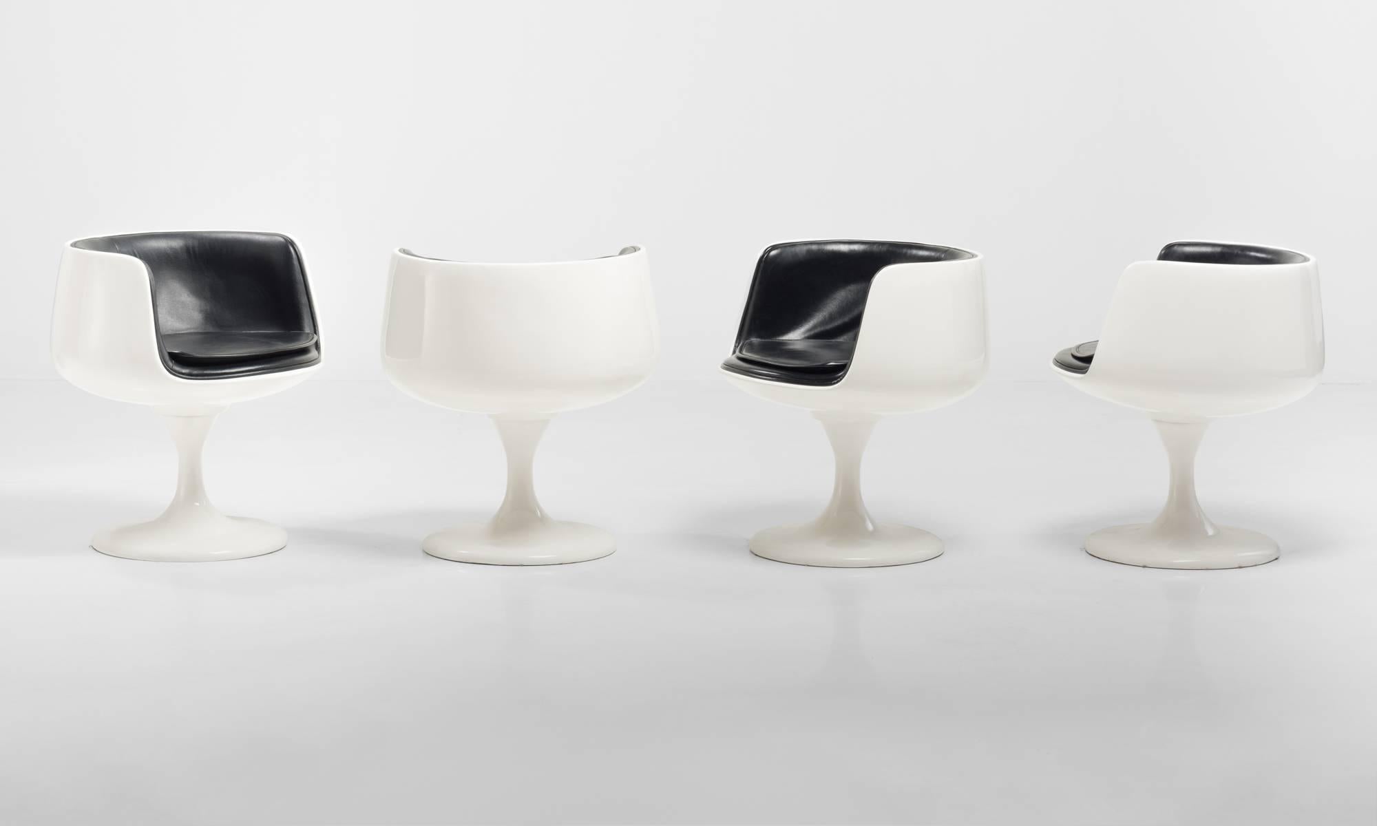 Set of (4) Eero Aarnio Style Dining Chairs, Finland, circa 1960

Swivel chairs with fiberglass base and black vinyl upholstery, in the style of Eero Aarnio.