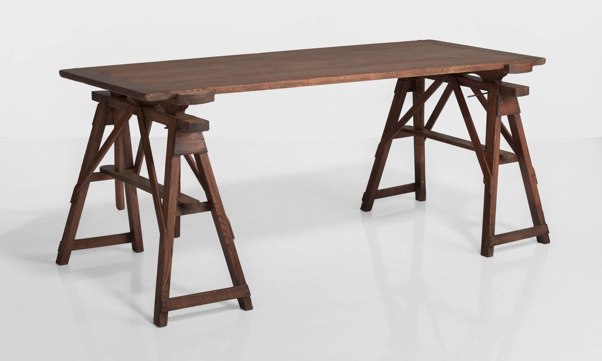 Pine Architect's Table, France circa, 1910.

Four plank pine top on pine stretchers. Wonderful color and adjustable surface height.