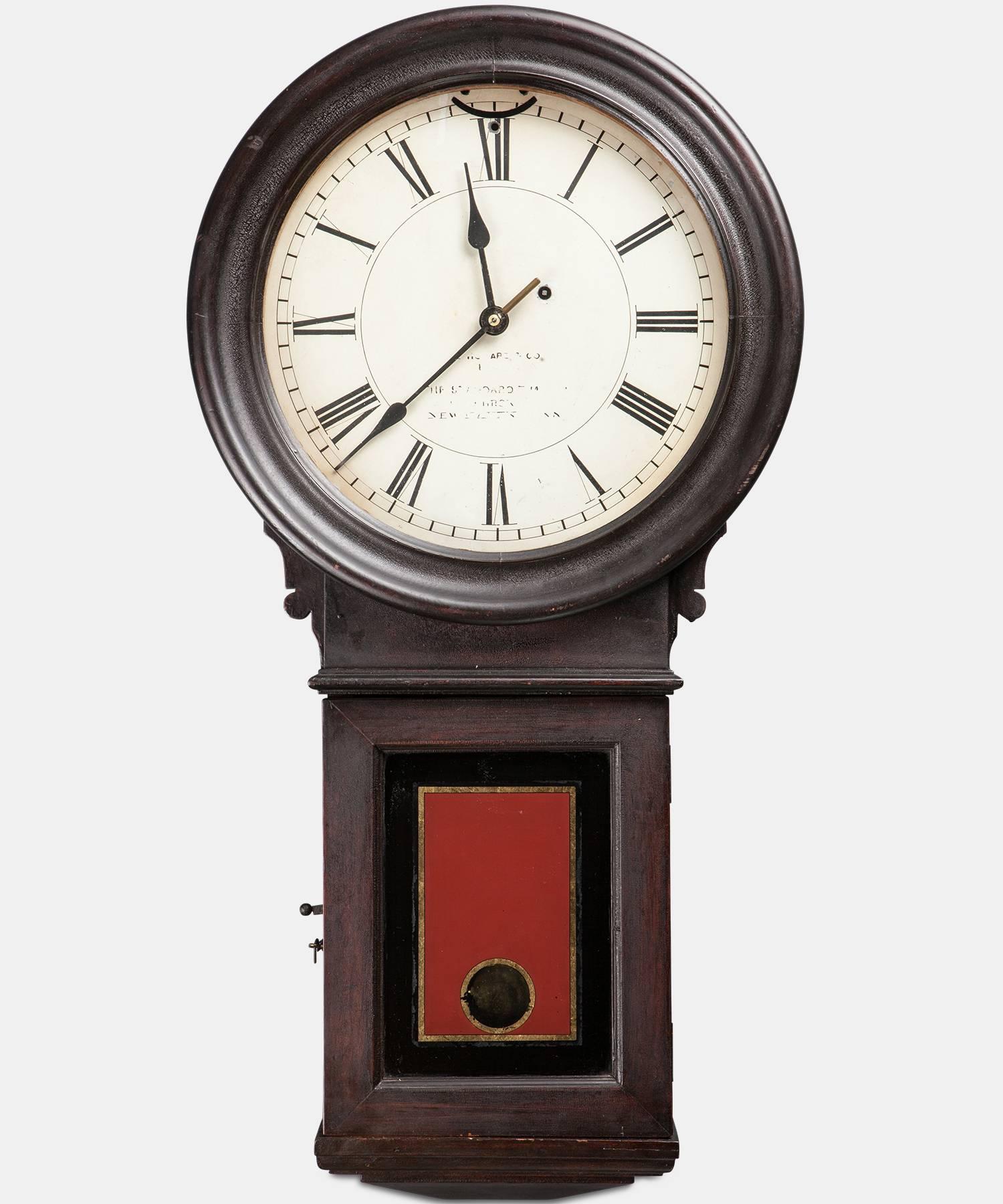 Model #70, pendulum clock with iron weight. In completely original condition with walnut case, painted zinc dial, gold leaf and red painted throat glass. 

Manufactured by E. Howard & Co. Boston, circa 1900.