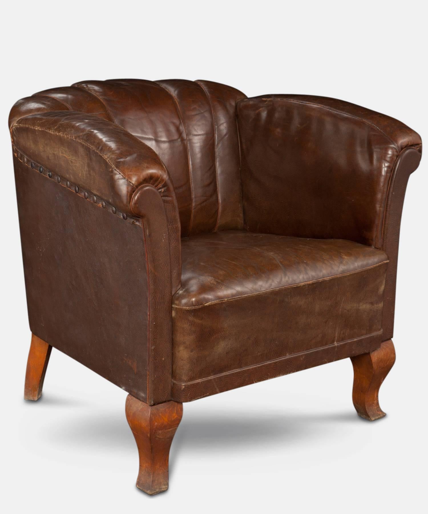 Original leather with oak cabriole legs.