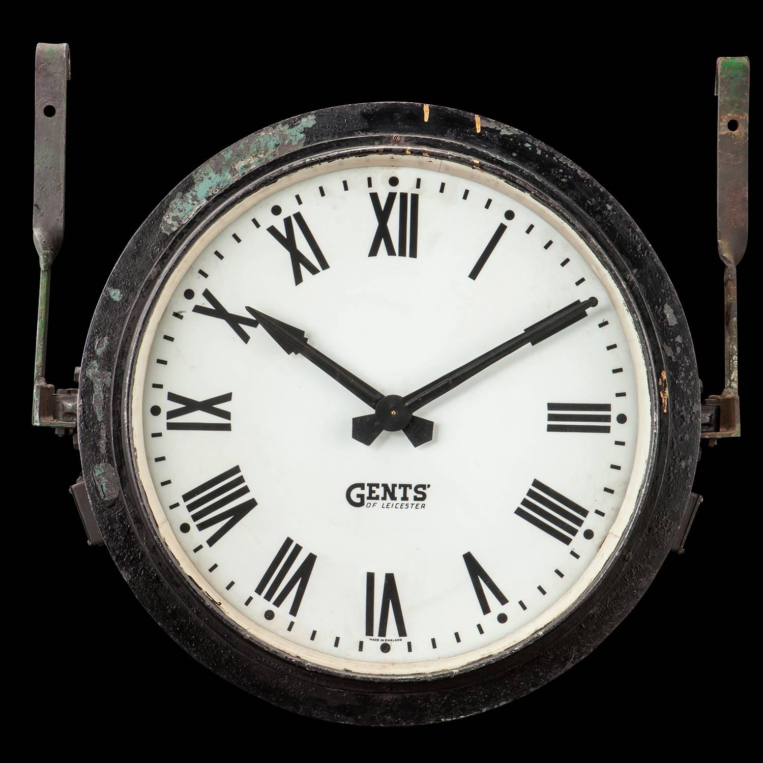 A large steel case with opaline glass twin faced illuminated station clock.