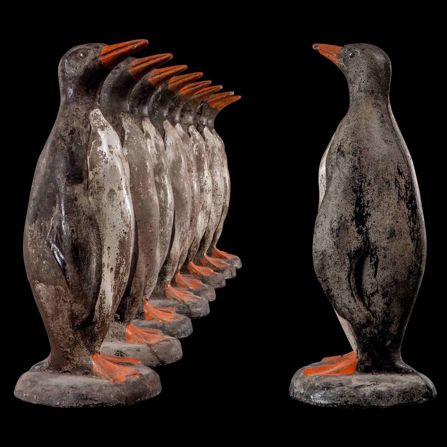 Composite stone penguins with original paint.