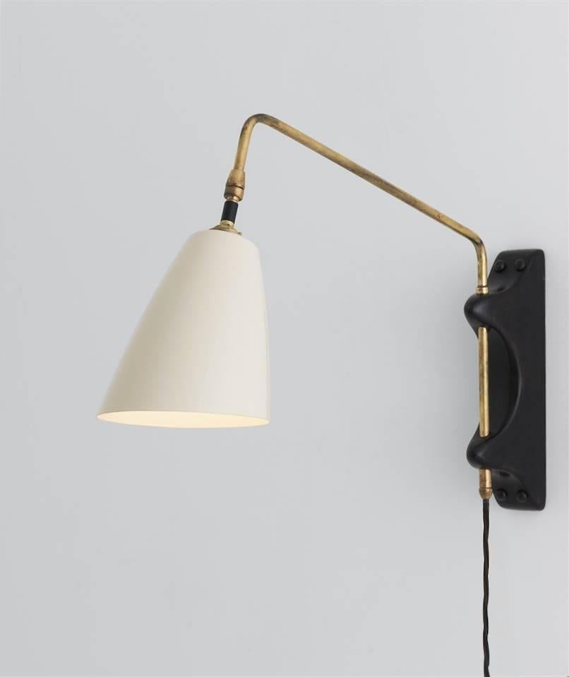 With ebonised wood backplate, brass hardware, and black metal shade. Interior can be painted saffron yellow. Designed and produced in Gloucestershire England.

Made in England

Please specify amount of cord, on / off switch location on cord, and