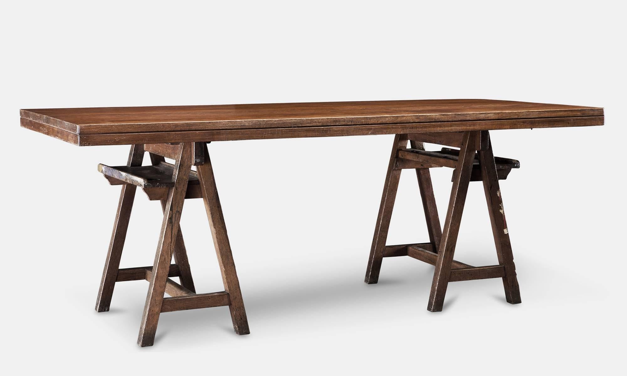Table created from a pair of oak artists trestles with a mahogany laboratory table top.