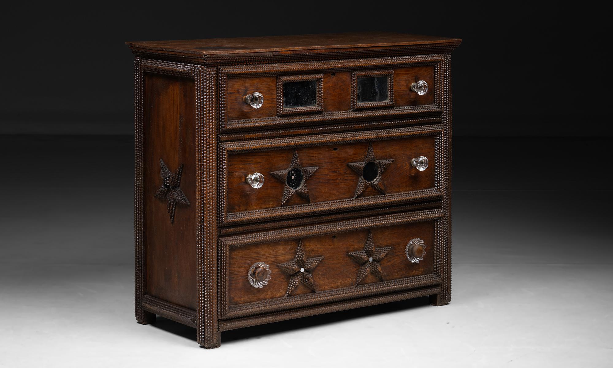 Tramp Art Chest

France circa 1900

Chest of drawers with extensive finite detailing, glass knobs, and mirror on drawers.

Measures 43.25”L x 19.5”d x 38.25”h