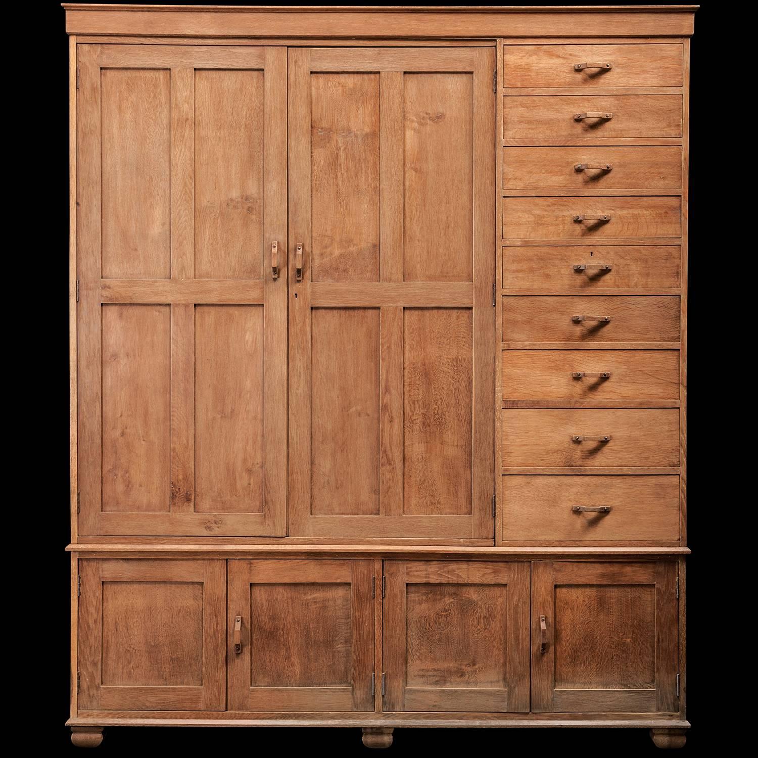 A custom ordered Heals of London wardrobe, featuring a two-door robe pod, cupboard base and tall bank of drawers.