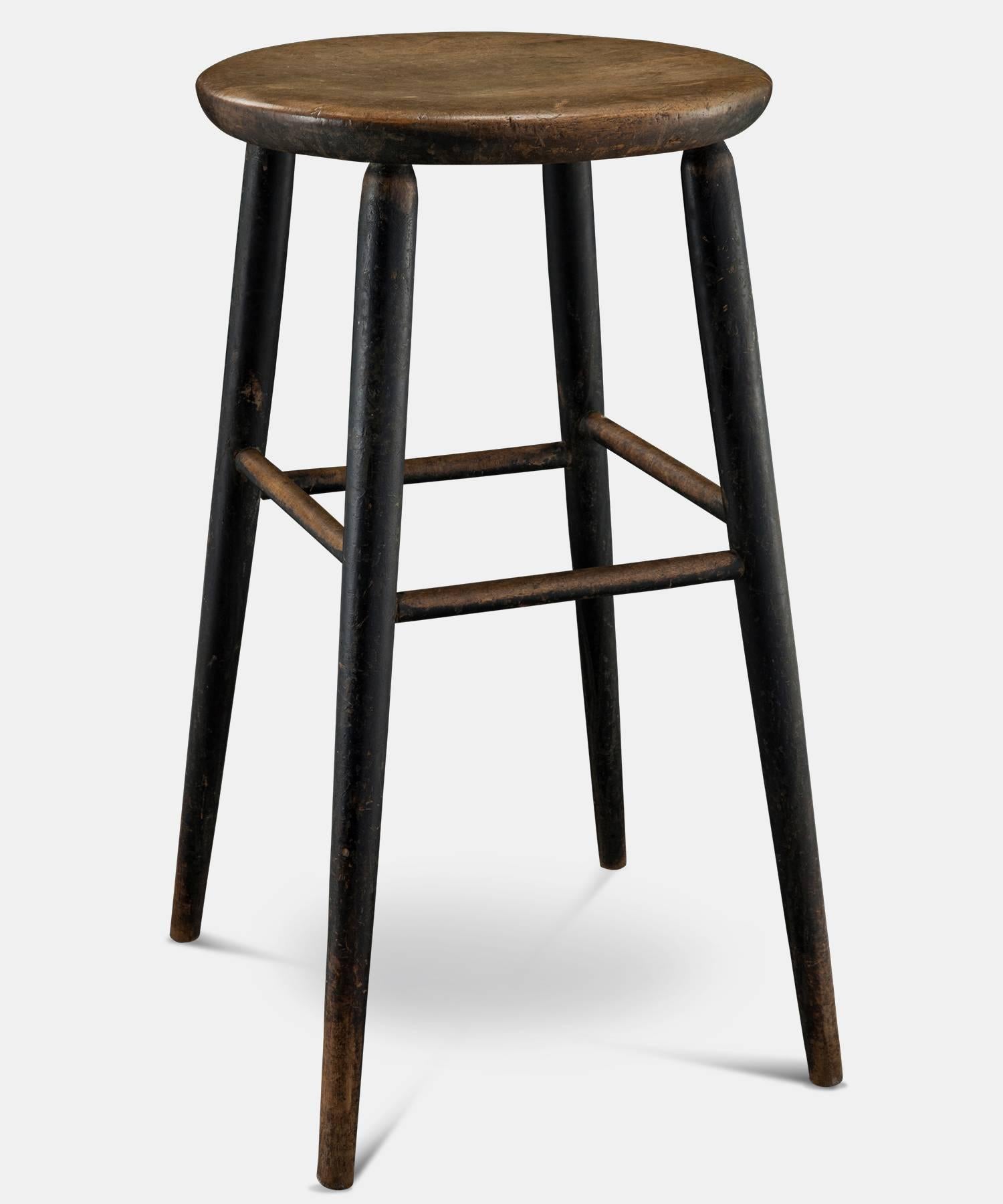 Tall maple stool with worn original ebonized finish.