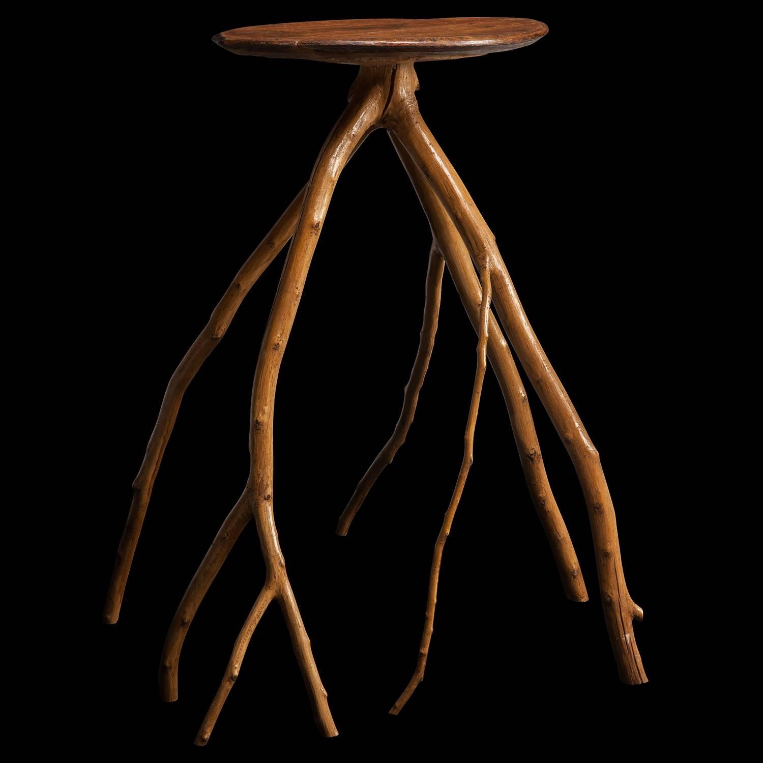 Unique table made from the branch of a tree, with oak top.