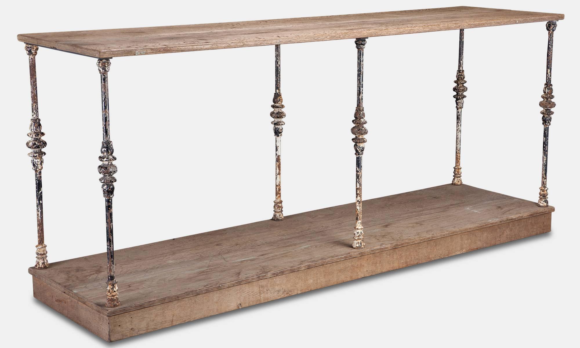 Pale oak shelves with cast iron supports.