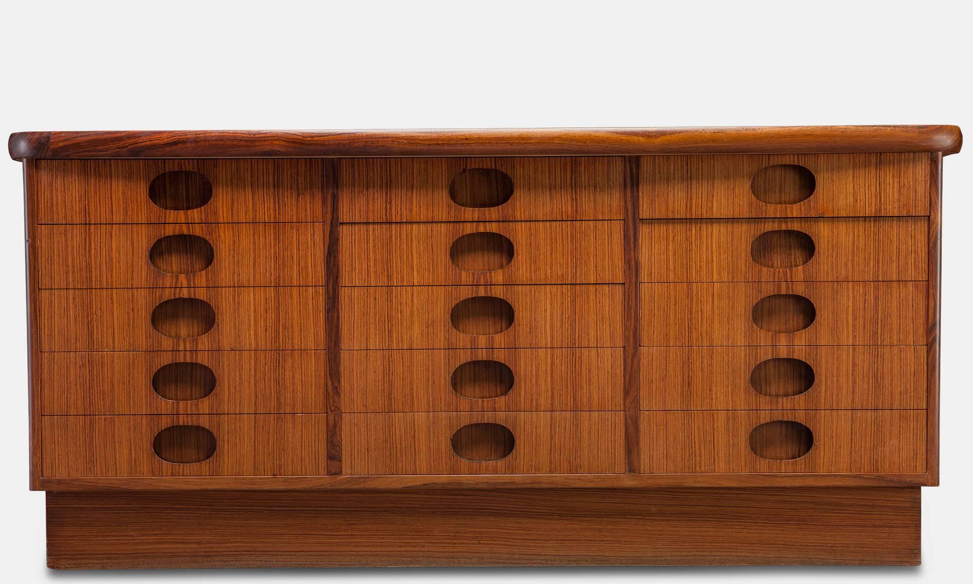 Modern Danish Cabinet, Denmark, circa 1960

With a beautiful grain and 15 drawers with oval cutout pulls. 