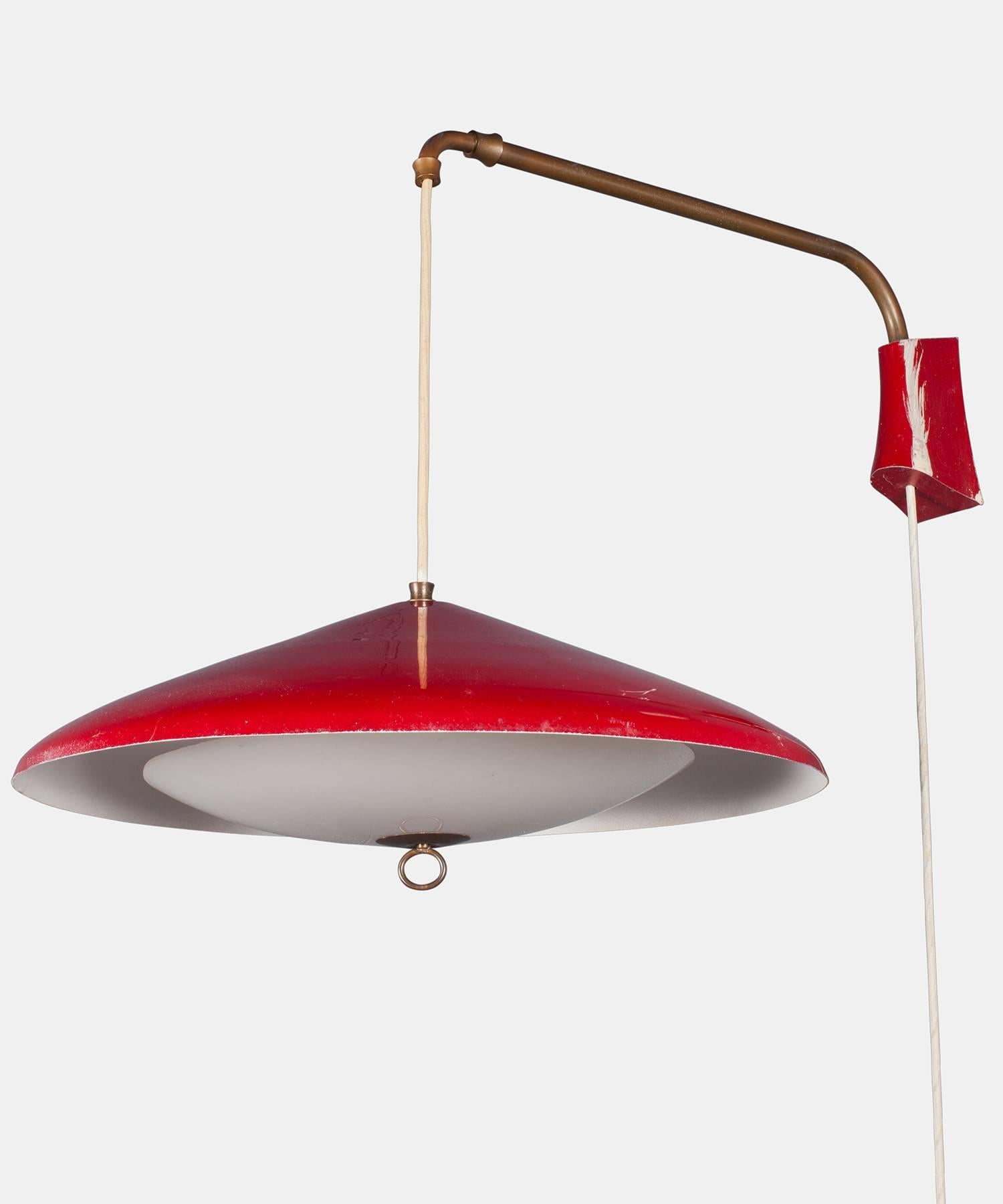 Red Modern Wall Mount Lamp, circa 1950

With red metal shade and wall mount. Includes articulating brass arm and a weight that enables fixture to change drop length.

7