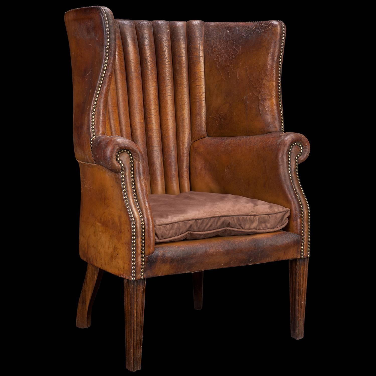 Original tan leather upholstery, with hardwood frame and suede duck down cushion.