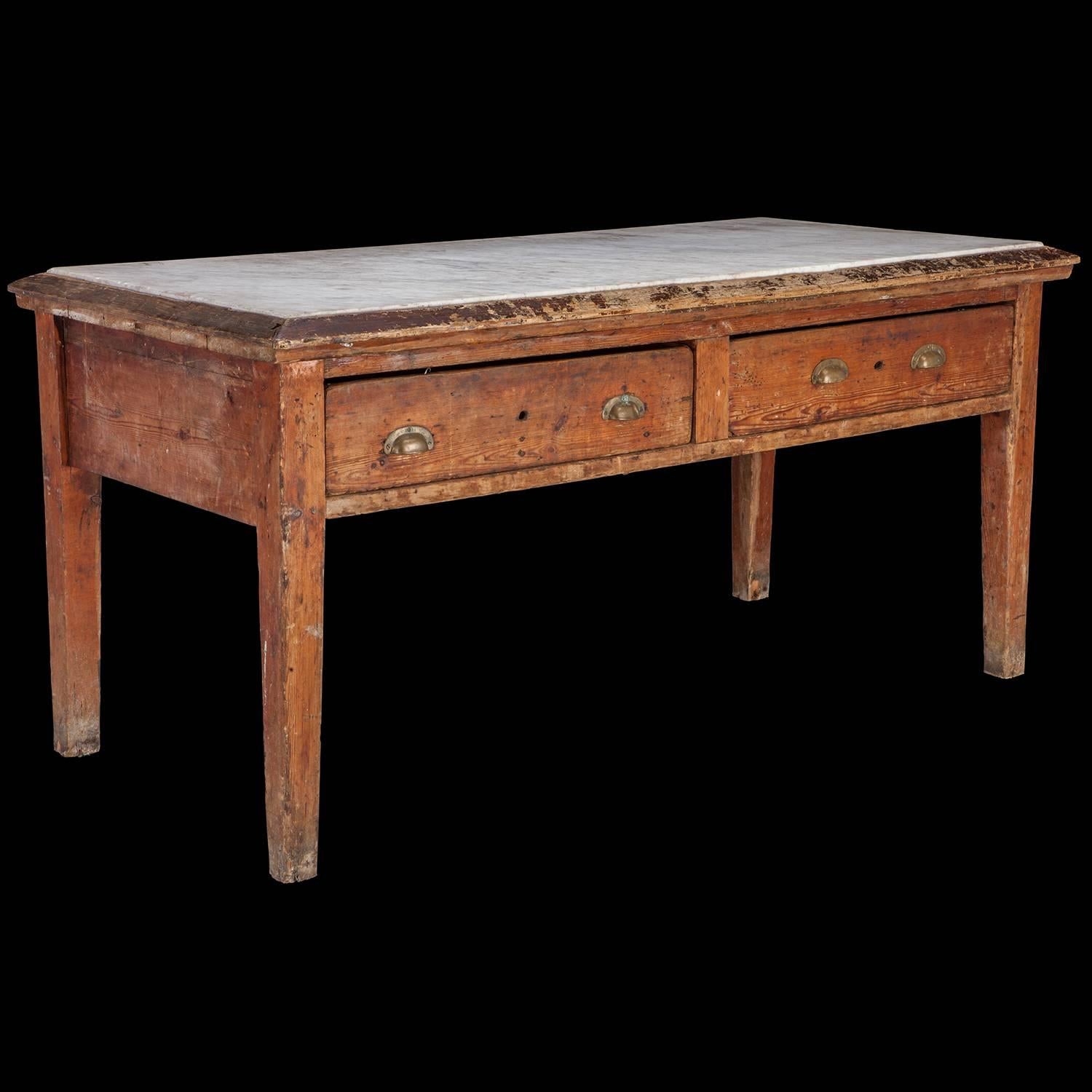 Two-drawer pine table with inset marble top and original brass pulls. Used to knead bread dough.