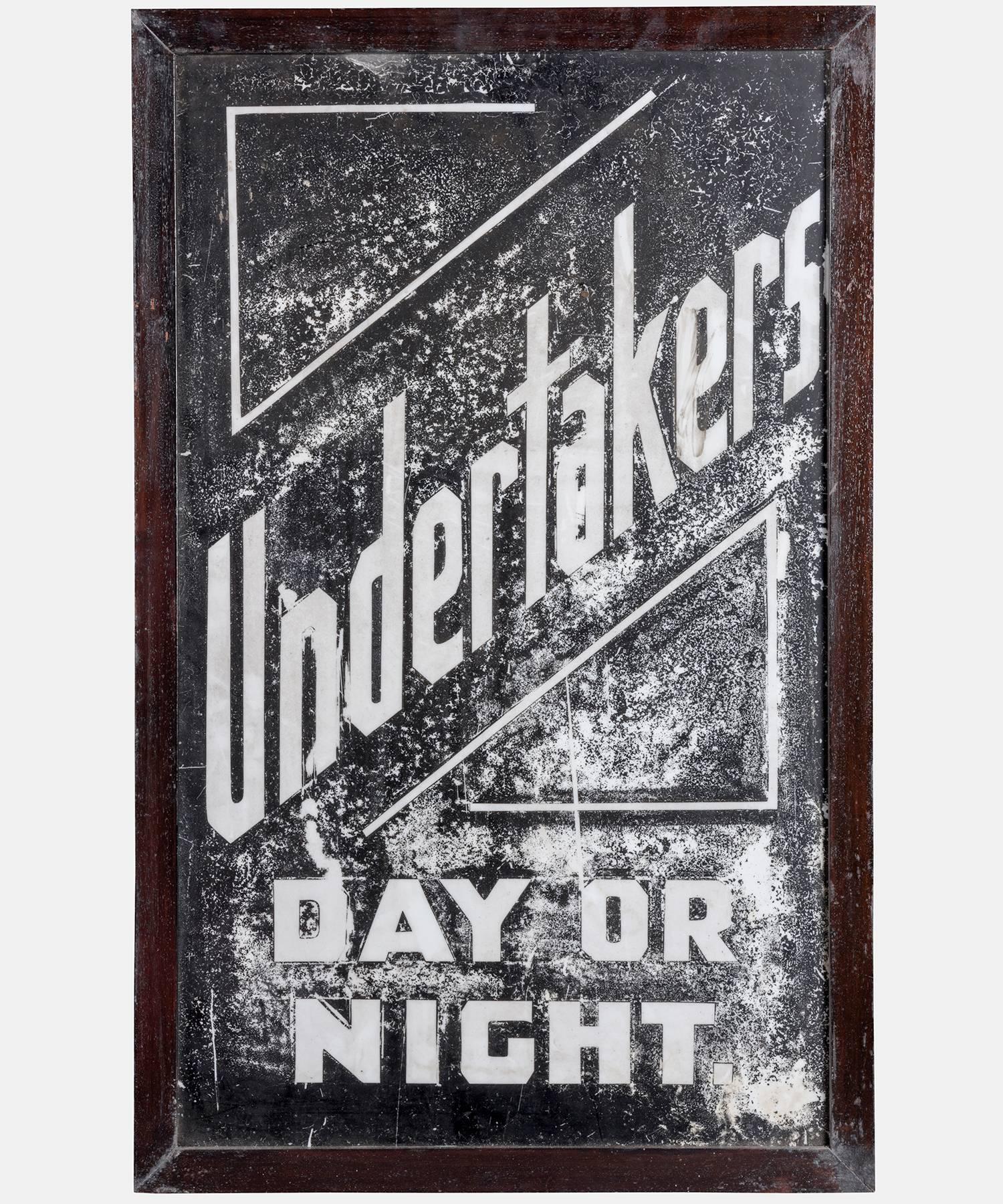 Opal glass painted sign, from an undertakers premise in Nottingham.