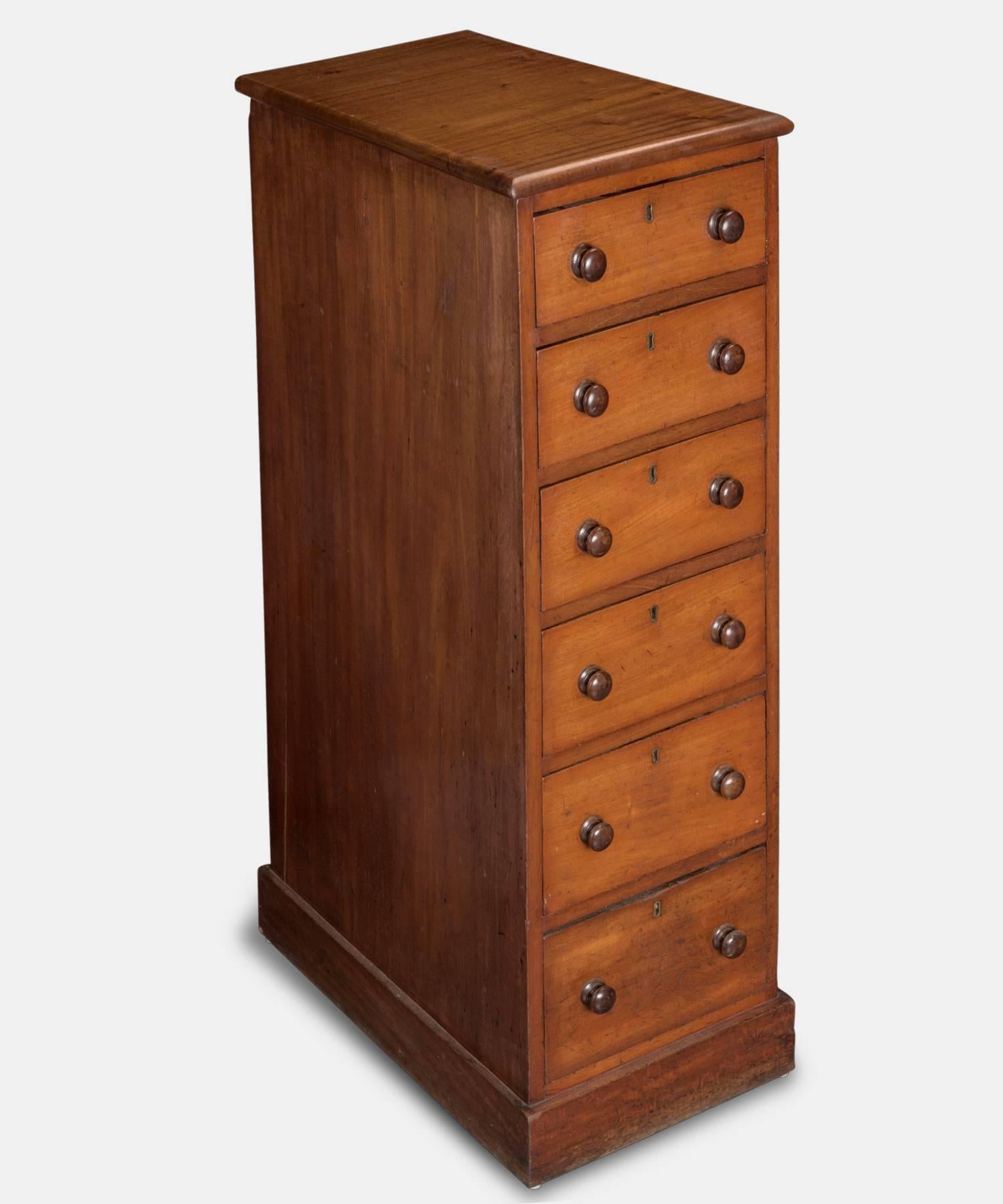 Tall Mahogany Chest of Drawers, England, circa 1870

Period turned wooden knobs, standing on square plinths with paneled backs. Drawers lined in ashwood.