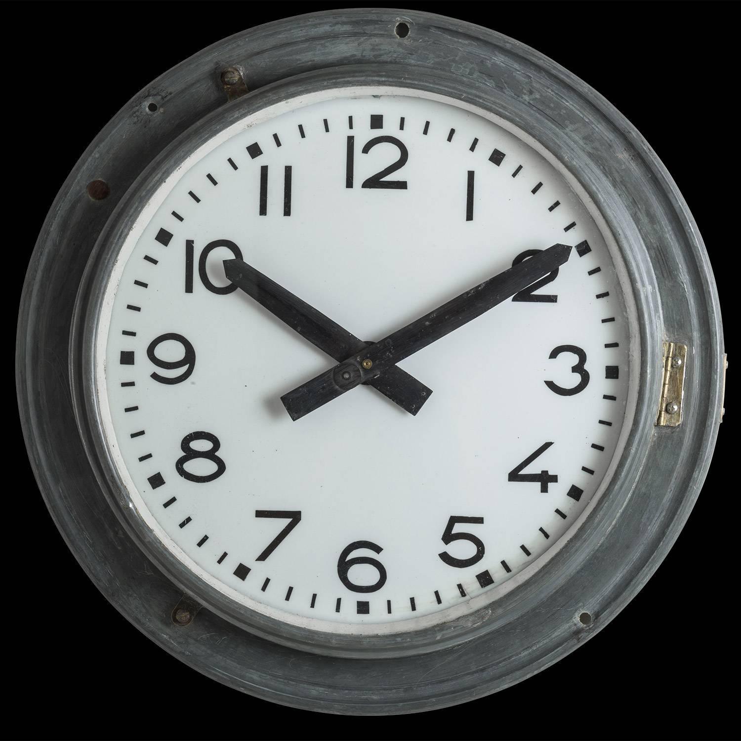 Zinc wrapped factory clock, produced by Brillié.