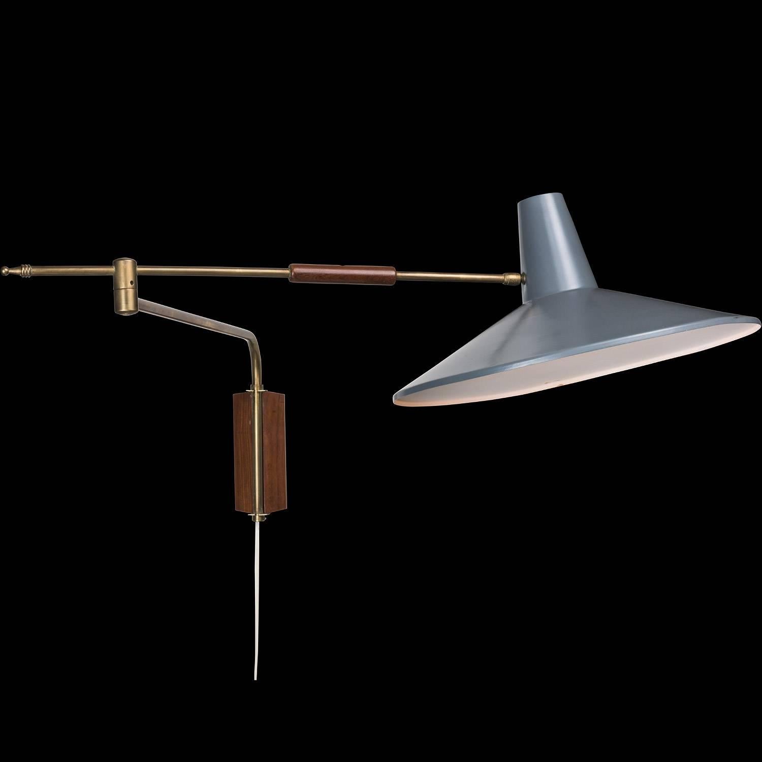 Brass and painted Metal Swing Arm Lamp, circa 1960.

Brass arm with mahogany details and bluish grey painted shade.