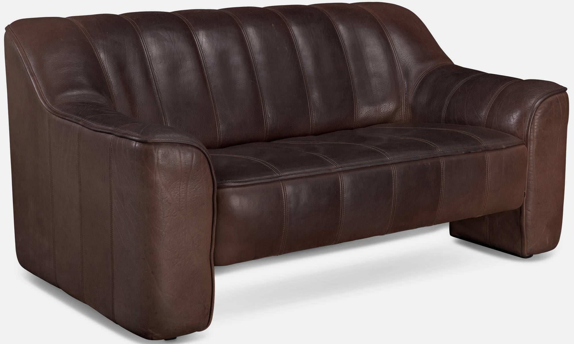 De Sede Leather Loveseat, circa 1970.

Model DS-44 two-seat sofa with original deep brown buffalo leather and solid wood frame.