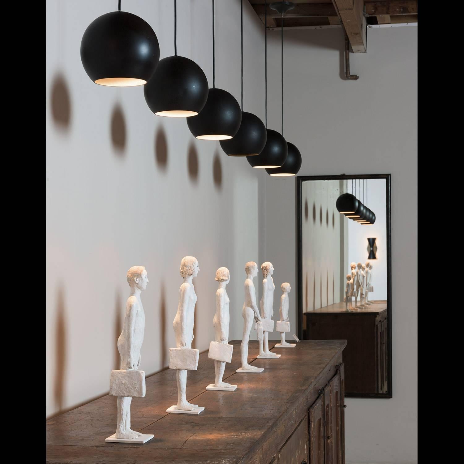 Stilnovo Black Metal Pendant, circa 1960. These pendants were purchased in Italy from Tecno/Borsani and were originally installed in the Tecno retail store in Milan.

They can be seen in the latest Borsani book (image included.)
