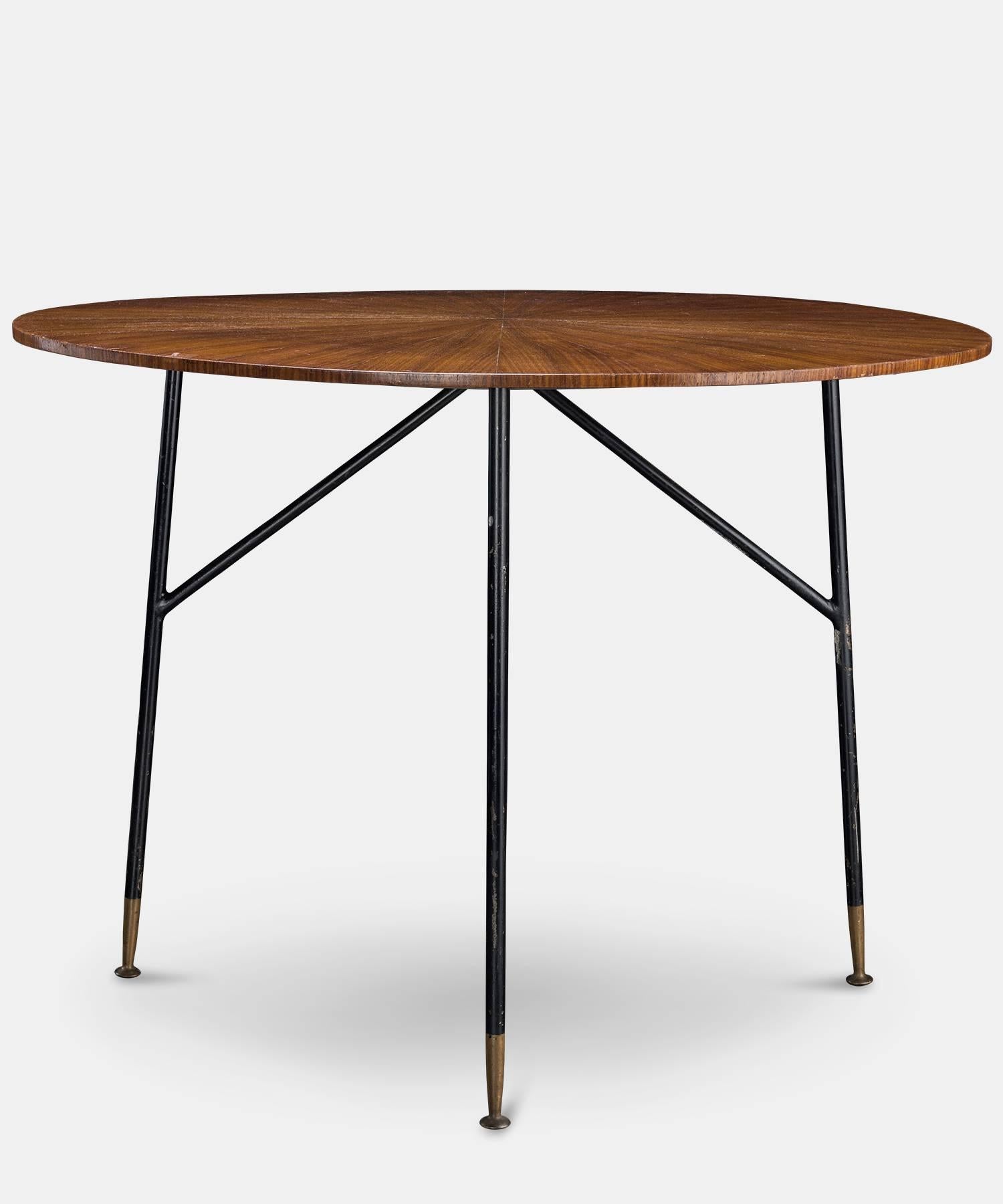 Sunburst wood and metal centre table, France, circa 1960.

Exquisite top on tall, modern metal legs. 