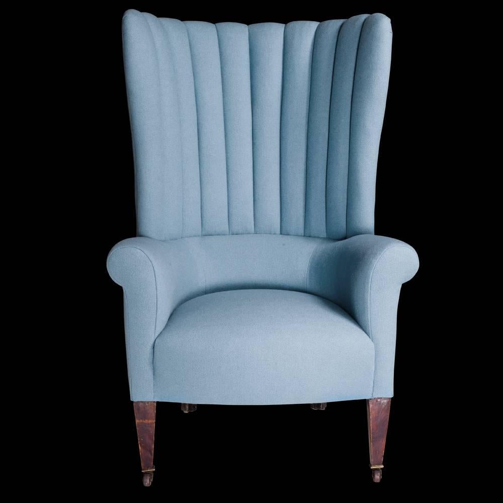 Pair of wool wingback chairs, circa 1830.

Porter's wingback chairs, newly reupholstered in blue wool fabric, with mahogany legs, on brass castors.