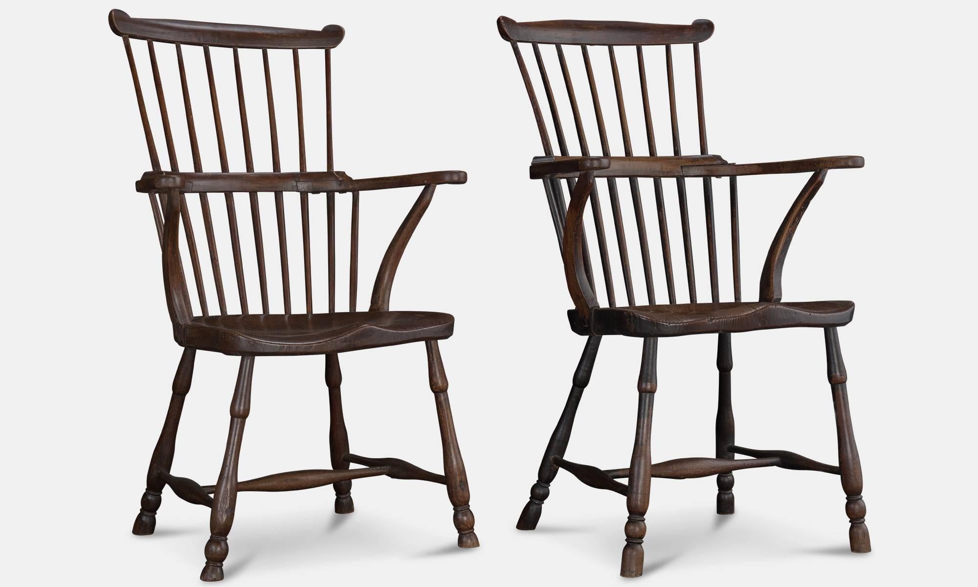 Pair of elm comb-back windsor armchairs, circa 1780.

With turned legs, and saddle seat. Great craftsmanship.
 