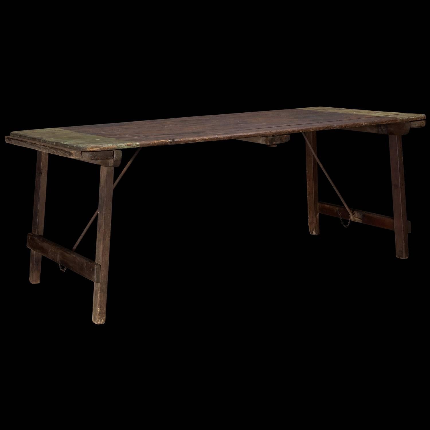 Victorian folding table with original iron states and period painted stripes.