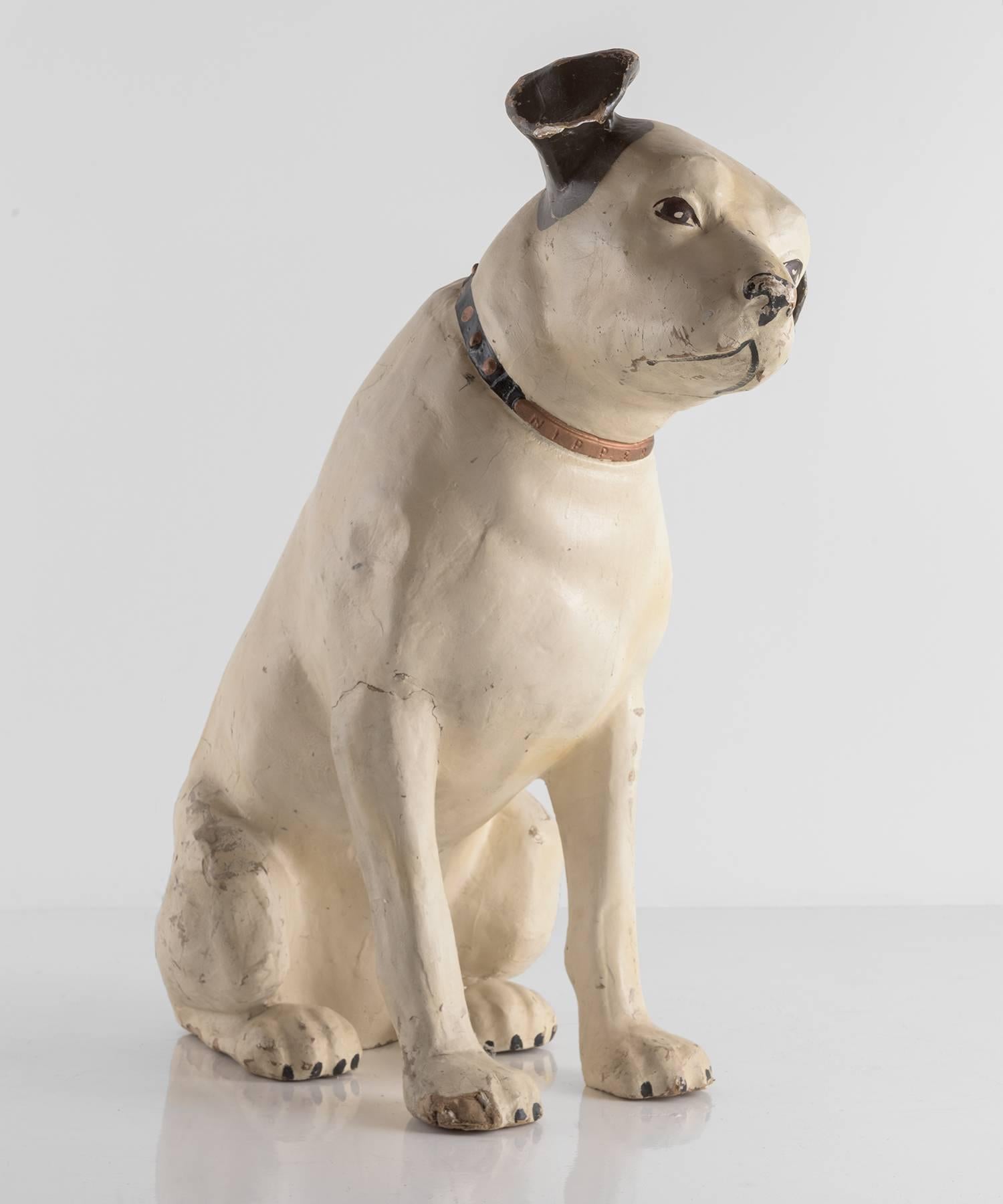 Papier mâché RCA victory nipper dog, circa 1920.

Folk art sculpture of a dog used for Display. Papier Mâché with delicately crafted features and original paint.