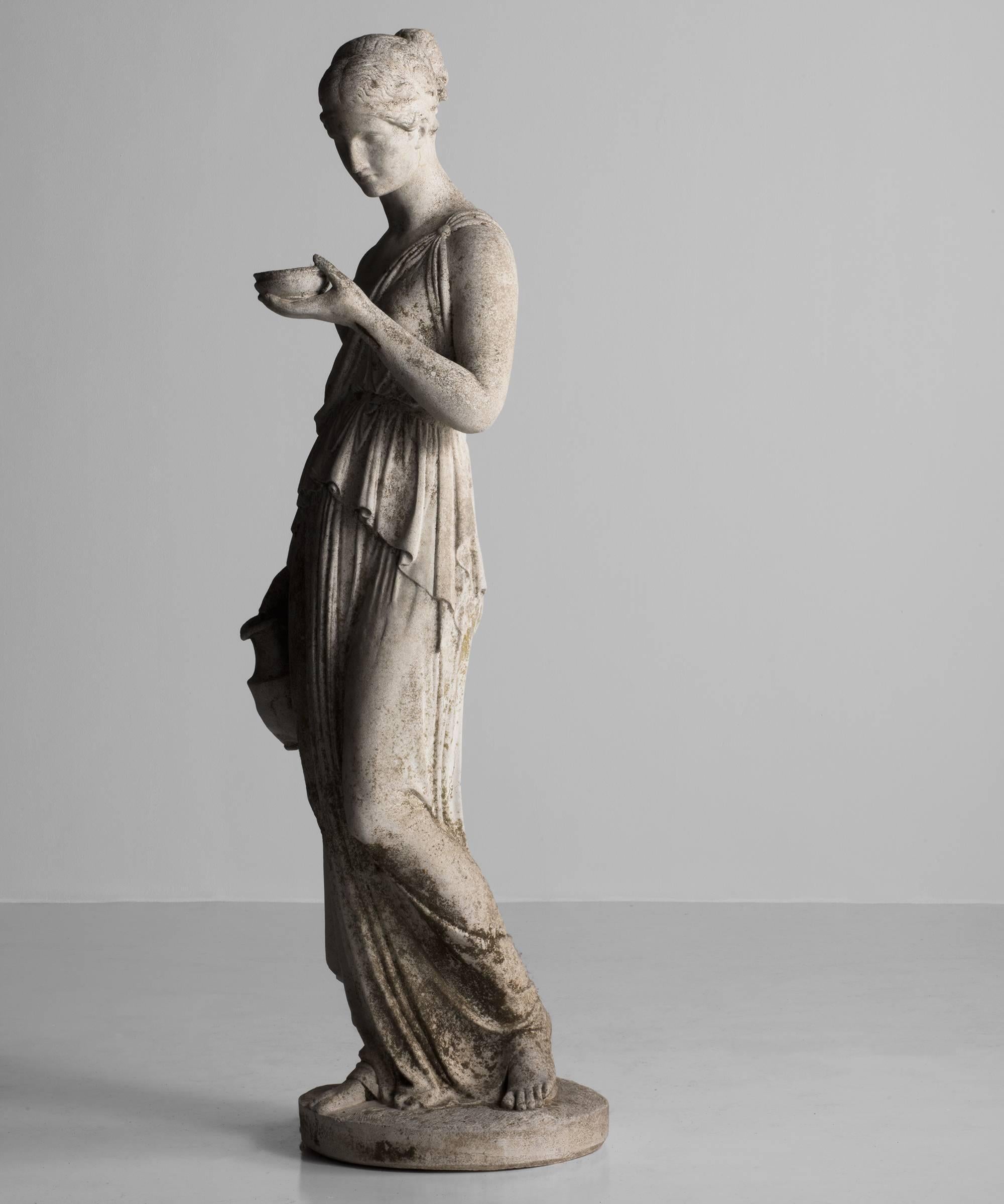 Italy, circa 1920.
Lifesize statue of women in a toga, made of cast limestone.