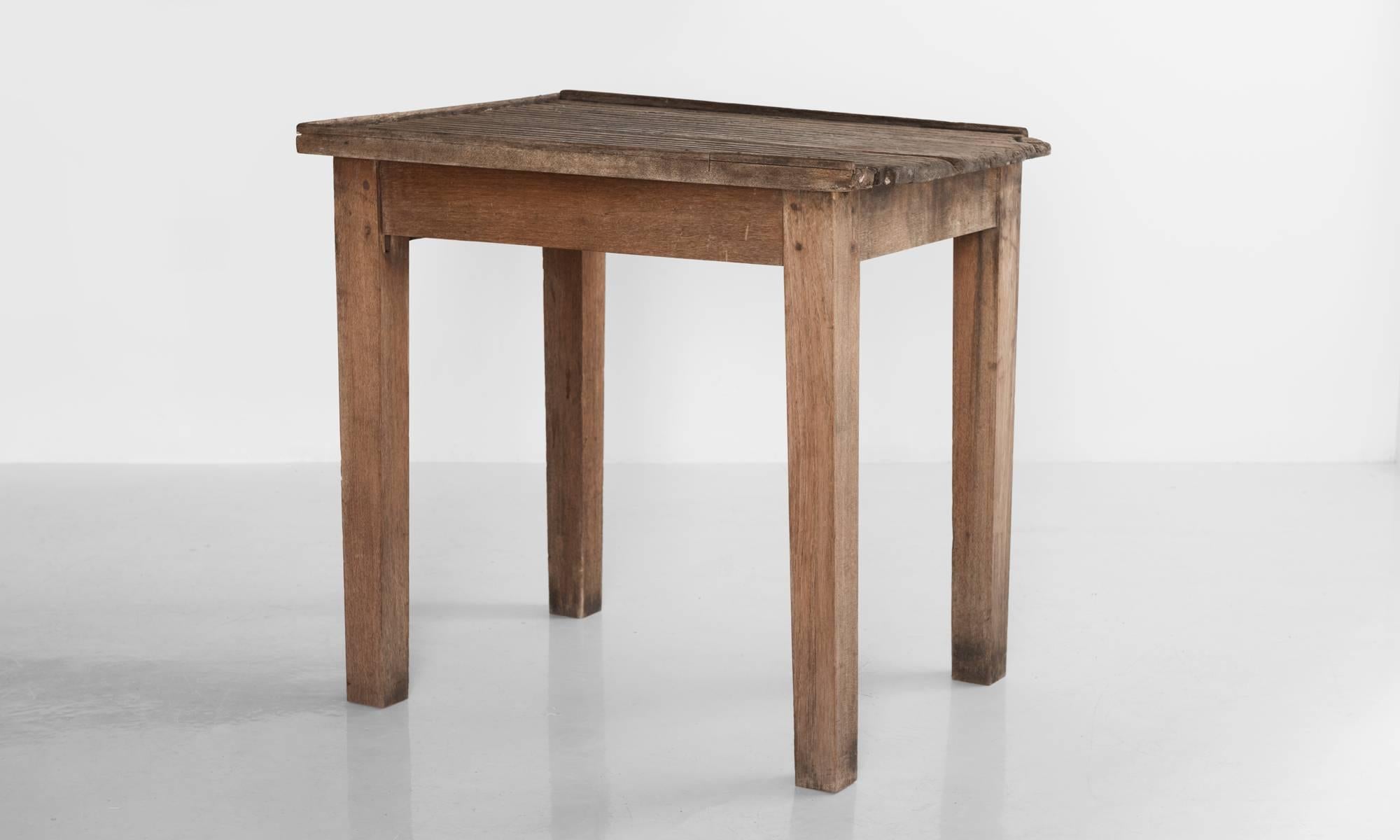 Unique oak tables, with well worn grooved surface for hand washing garments.