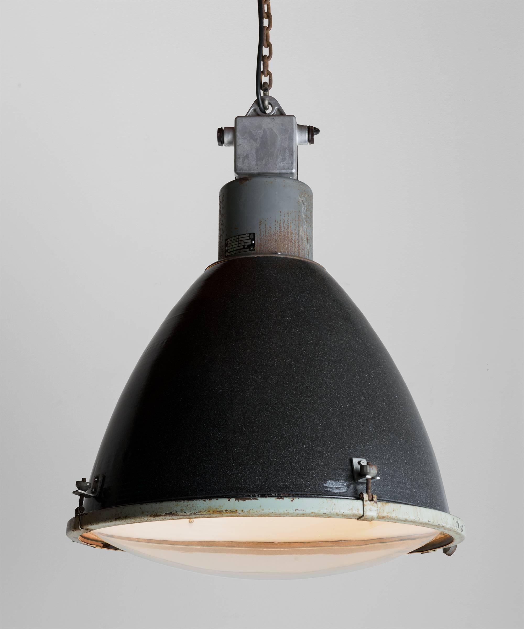 Black metal Industrial pendant, circa 1950.

Large factory light with original paint and convex glass shade.