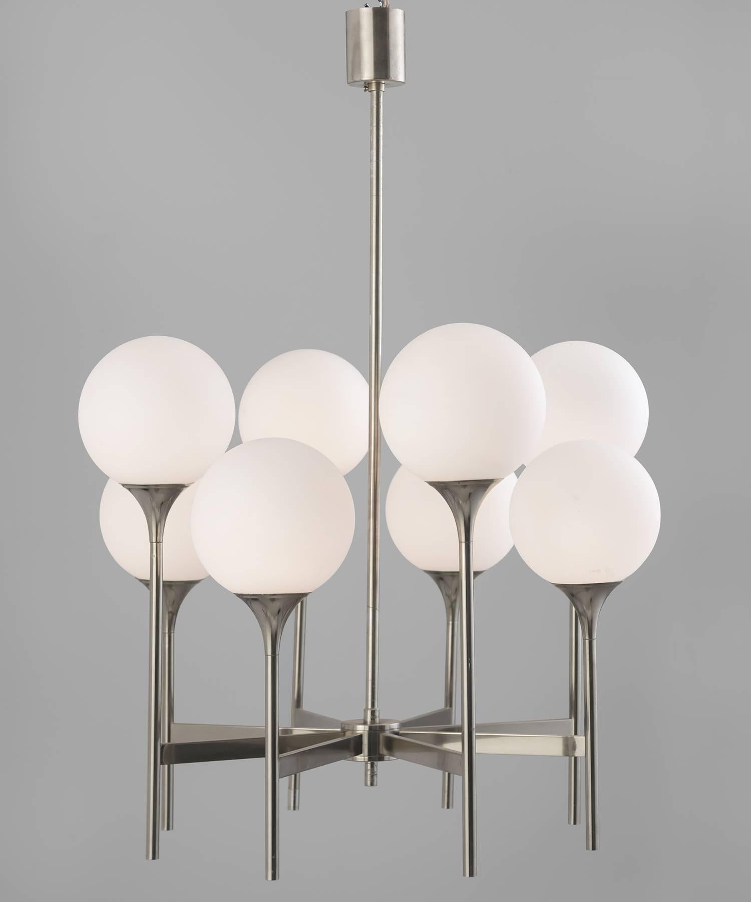 Chrome and frosted glass chandelier, circa 1970

Eight frosted globes on chrome fluted arms.